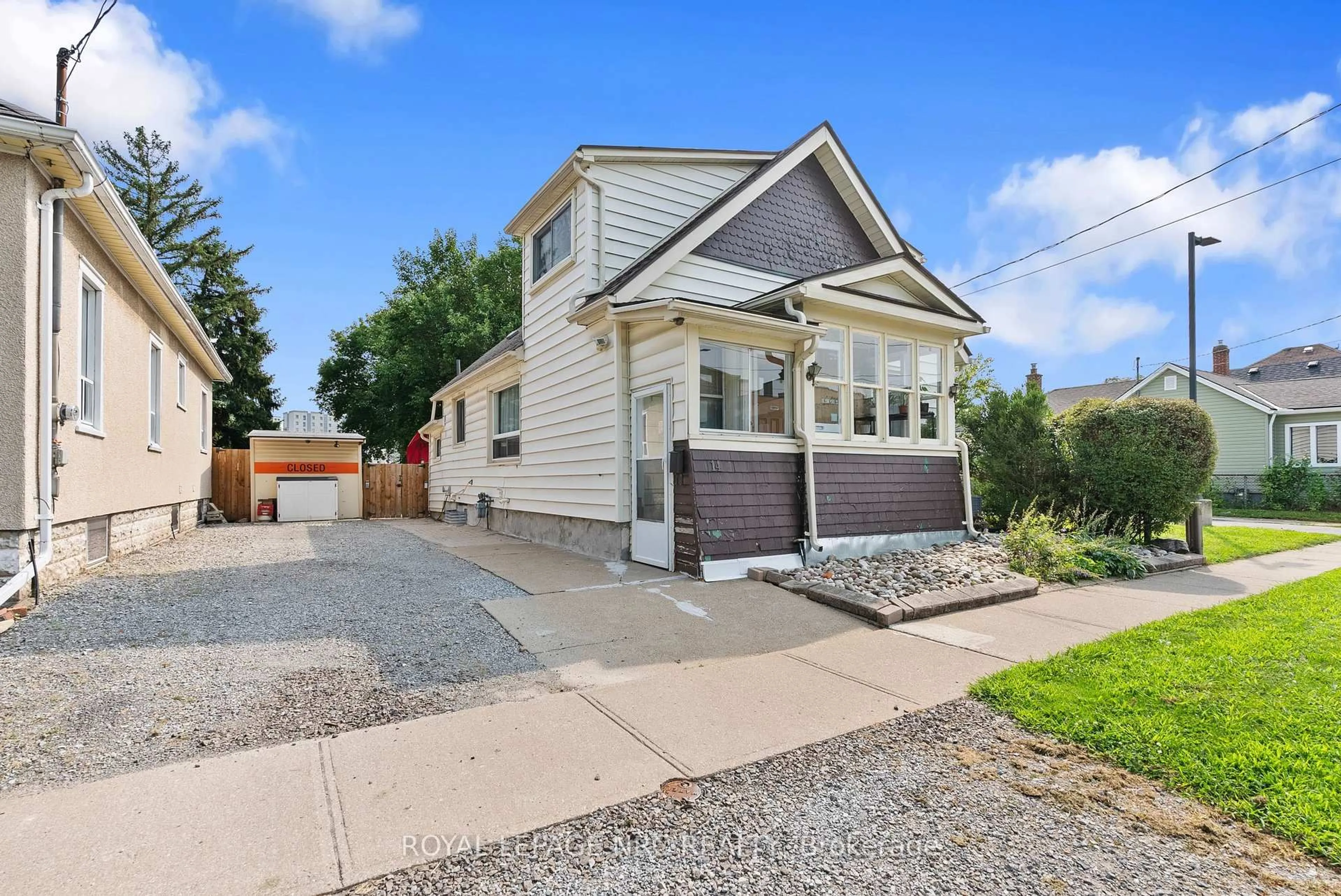 Home with vinyl exterior material, street for 14 Heatherington St, St. Catharines Ontario L2R 2G5