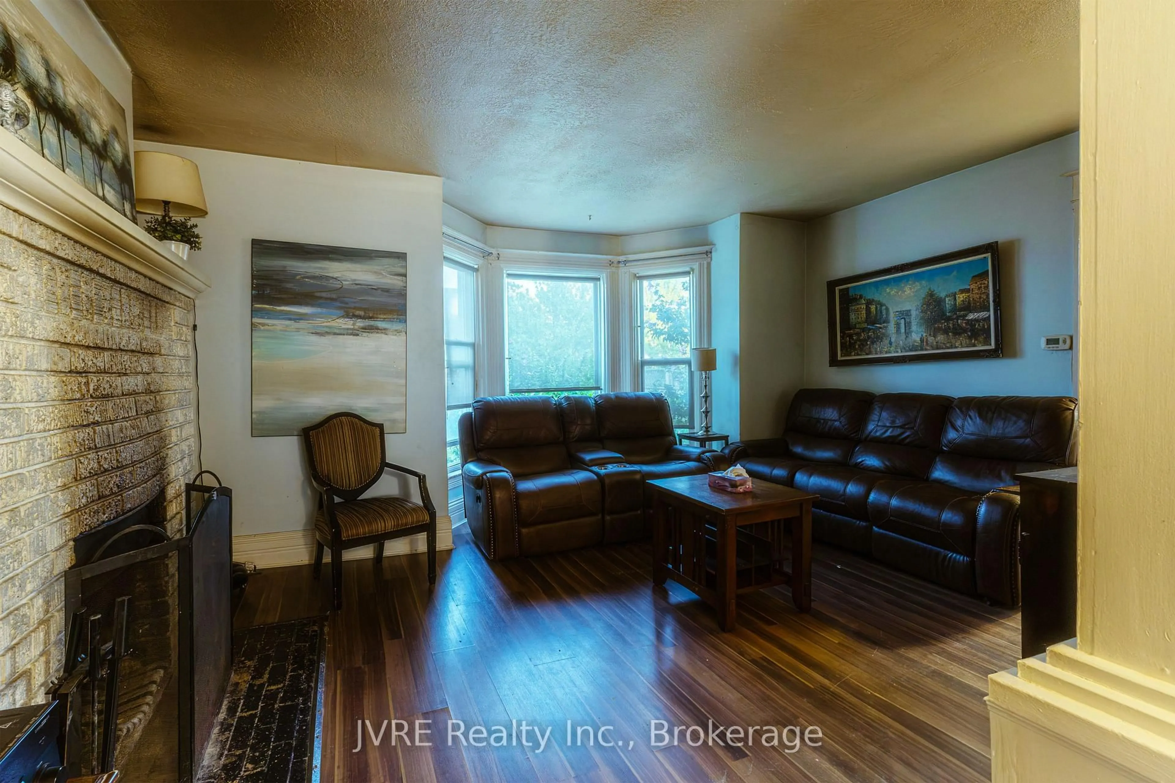 Living room with furniture, wood/laminate floor for 110 Merritt St, Welland Ontario L3C 4T4