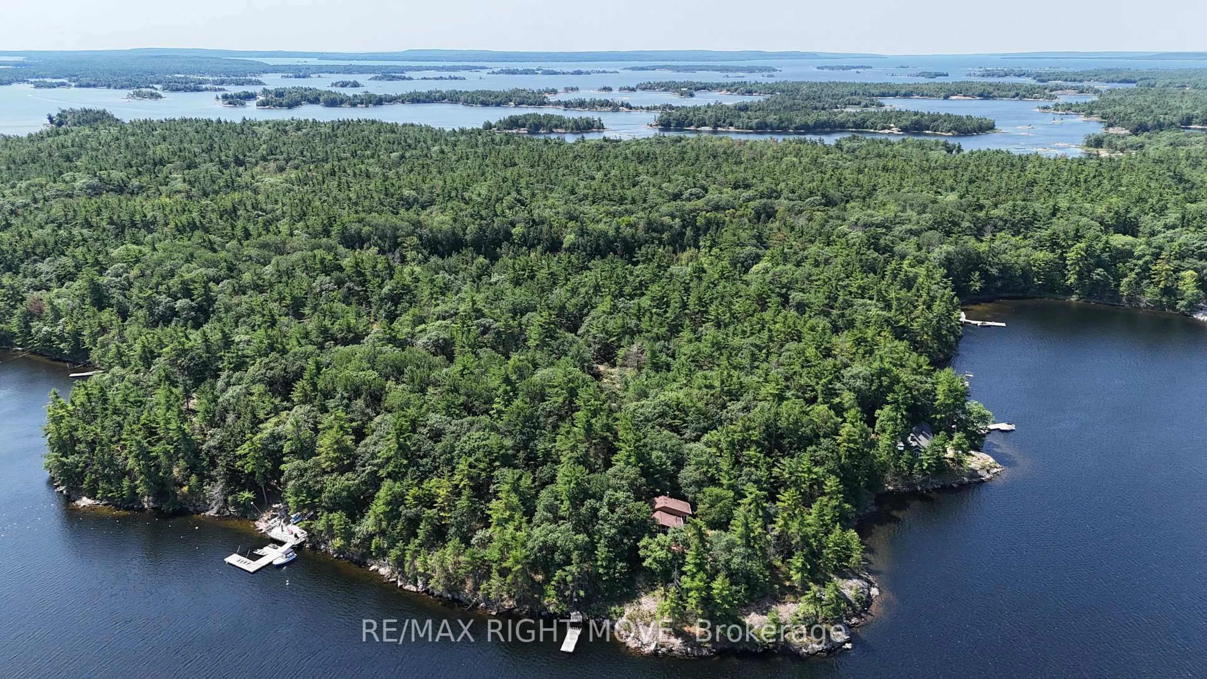 A pic from outside/outdoor area/front of a property/back of a property/a pic from drone, water/lake/river/ocean view for 3140 Island 1810, Georgian Bay Ontario P0E 1E0