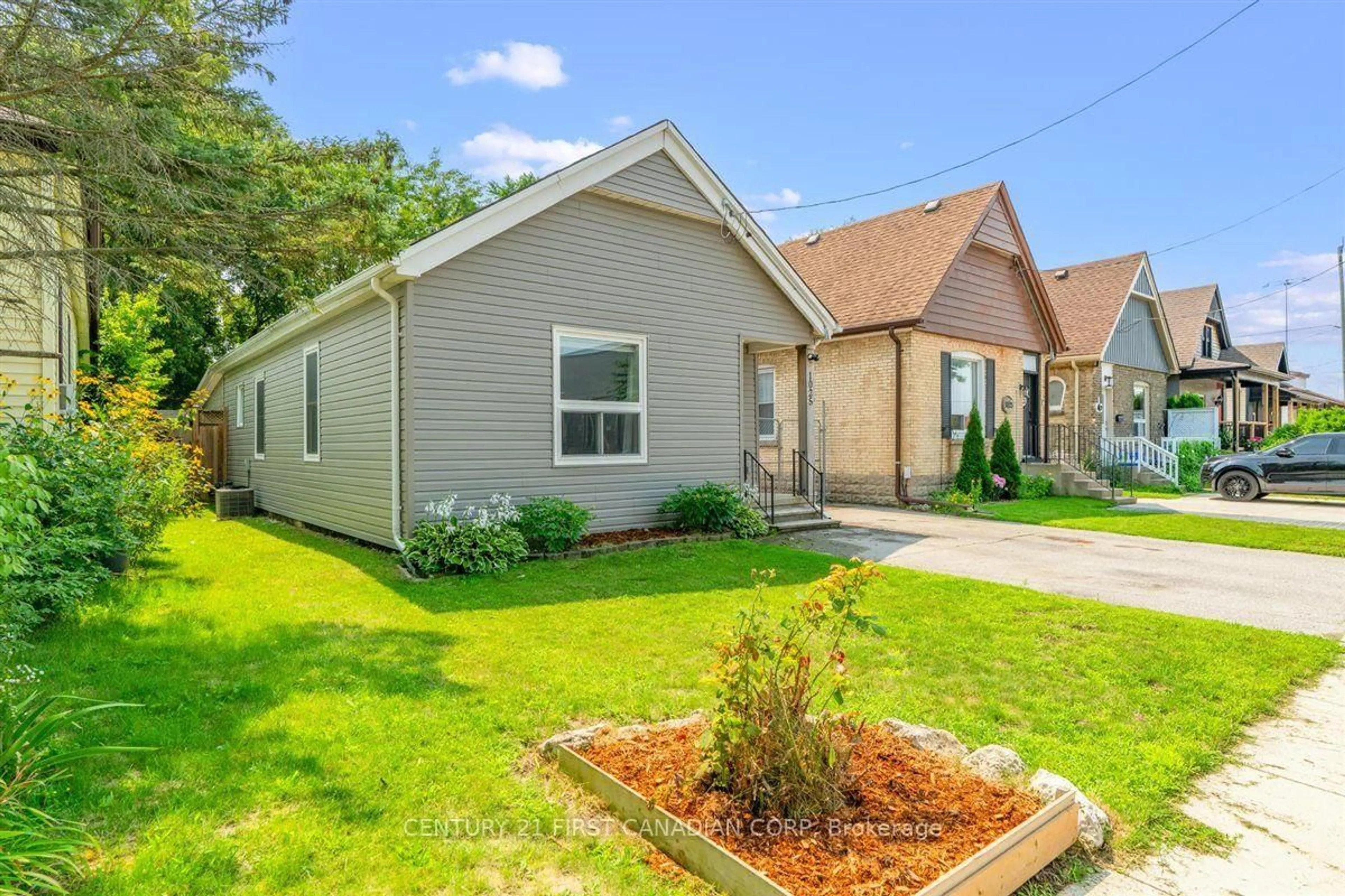 Home with vinyl exterior material, street for 1025 King St, London East Ontario N5W 2X7