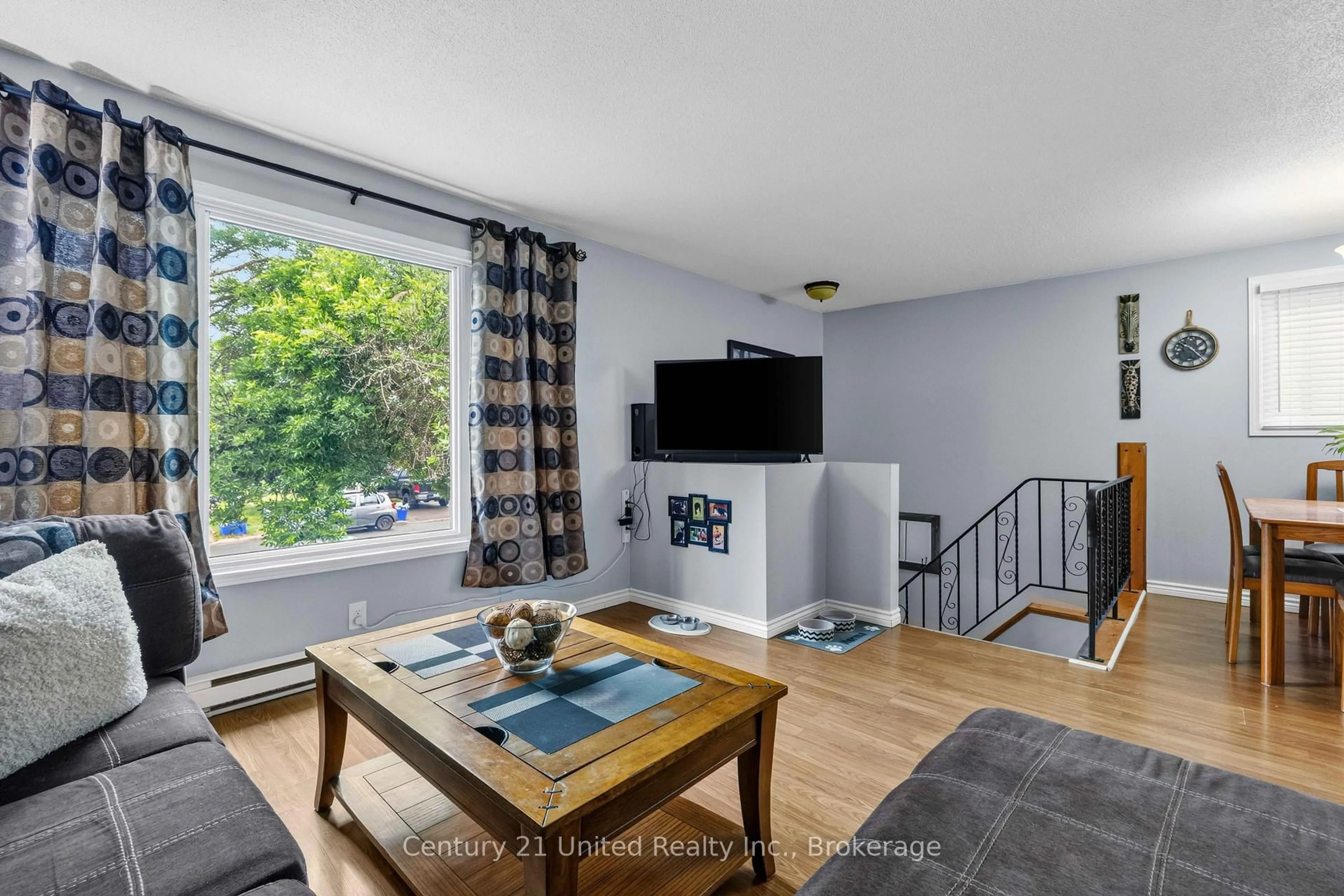 Living room with furniture, wood/laminate floor for 718 Mountain Ash Rd, Peterborough Ontario K9J 8K1