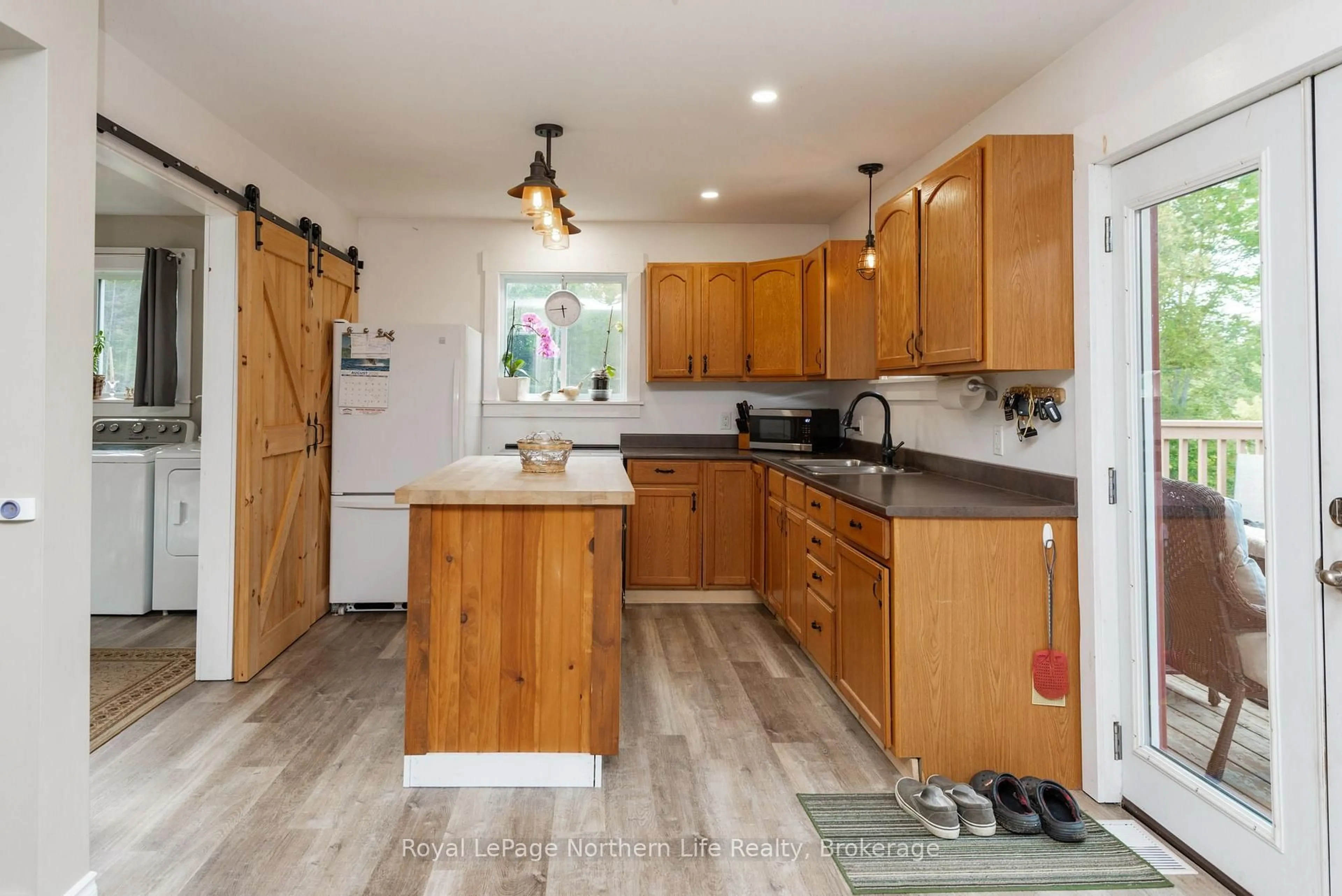 Open concept kitchen, wood/laminate floor for 1343 Golf Course Rd, Chisholm Ontario P0H 1Z0