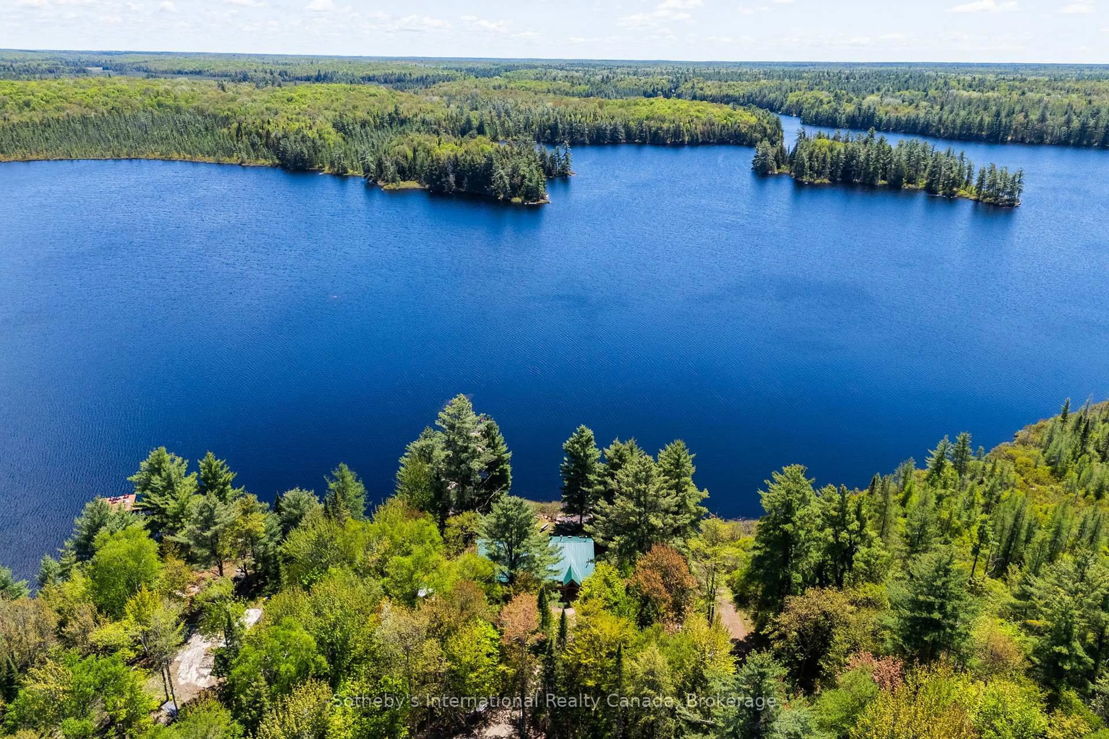 A pic from outside/outdoor area/front of a property/back of a property/a pic from drone, water/lake/river/ocean view for 3491A Axe Lake Rd, McMurrich/Monteith Ontario P0A 1Y0