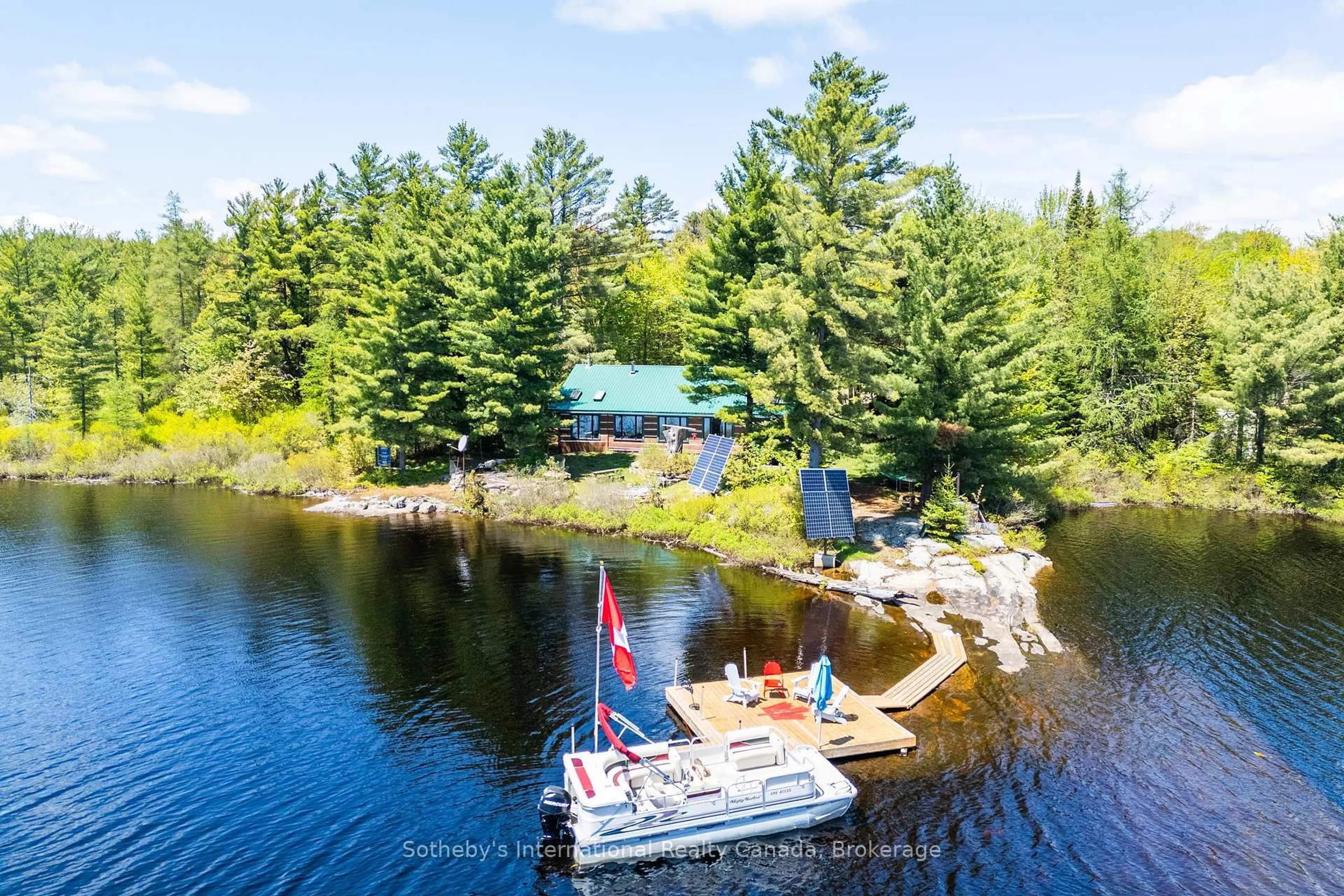A pic from outside/outdoor area/front of a property/back of a property/a pic from drone, water/lake/river/ocean view for 3491A Axe Lake Rd, McMurrich/Monteith Ontario P0A 1Y0