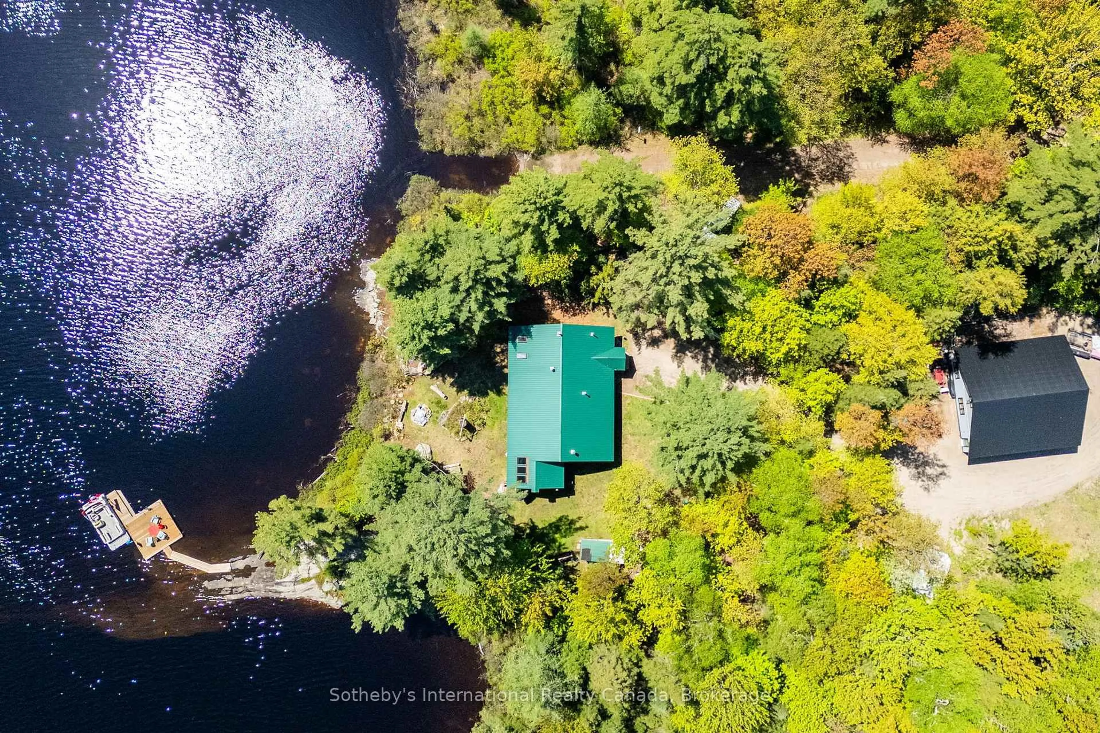 A pic from outside/outdoor area/front of a property/back of a property/a pic from drone, water/lake/river/ocean view for 3491A Axe Lake Rd, McMurrich/Monteith Ontario P0A 1Y0