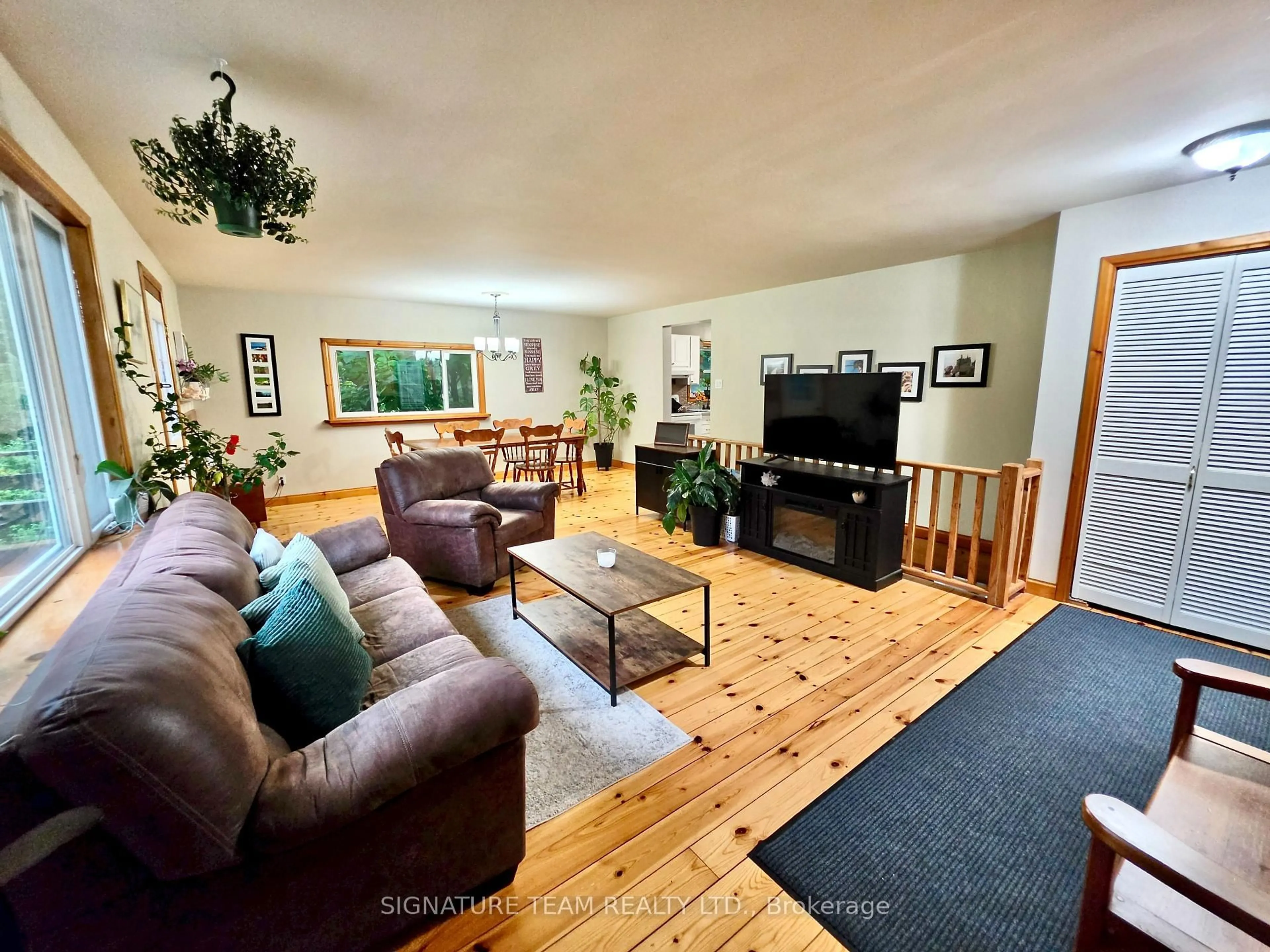 Living room with furniture, wood/laminate floor for 57 Gleason Lane, Deep River Ontario K0J 1P0