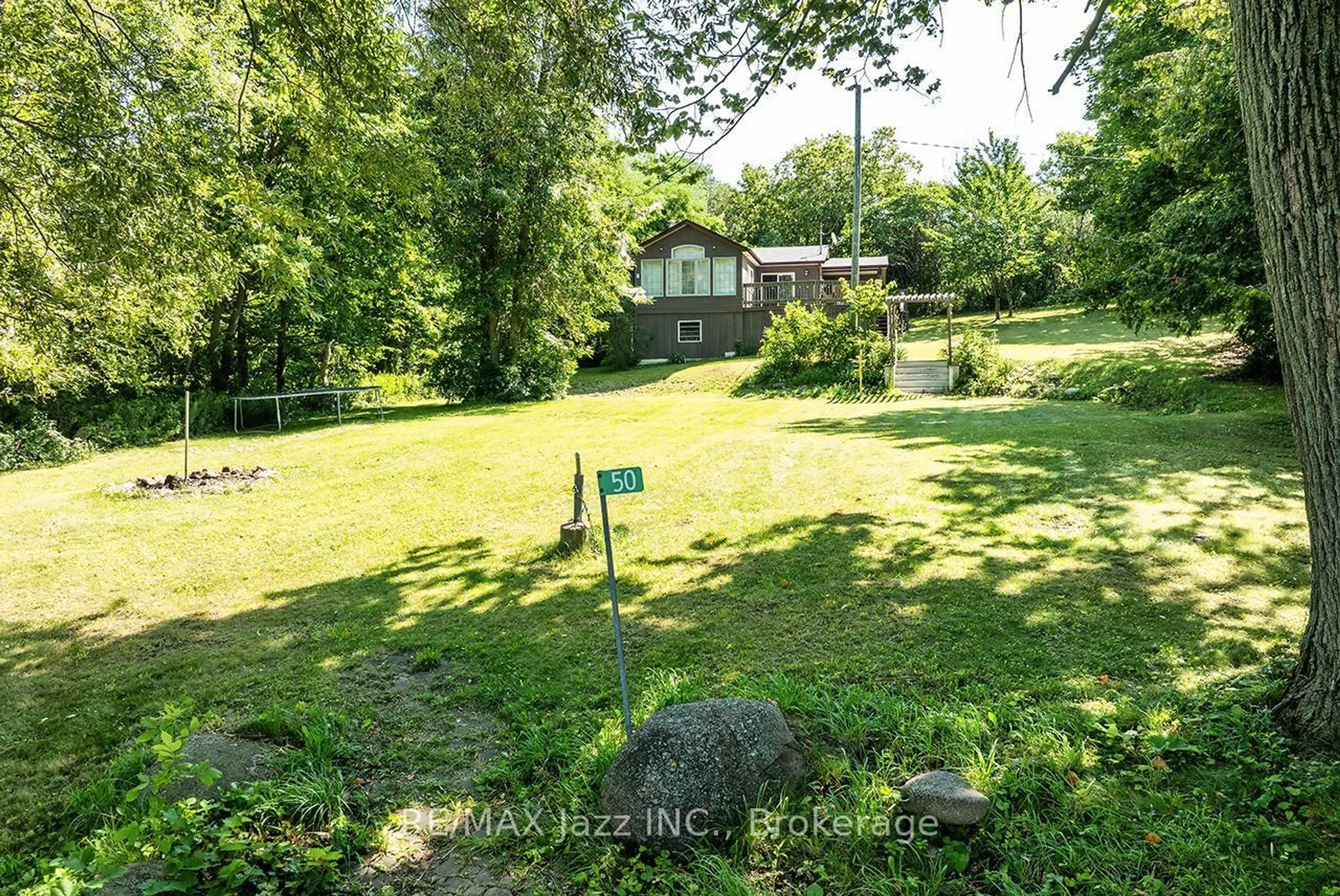 A pic from outside/outdoor area/front of a property/back of a property/a pic from drone, unknown for 50 Long Island, Otonabee-South Monaghan Ontario K0L 1B0