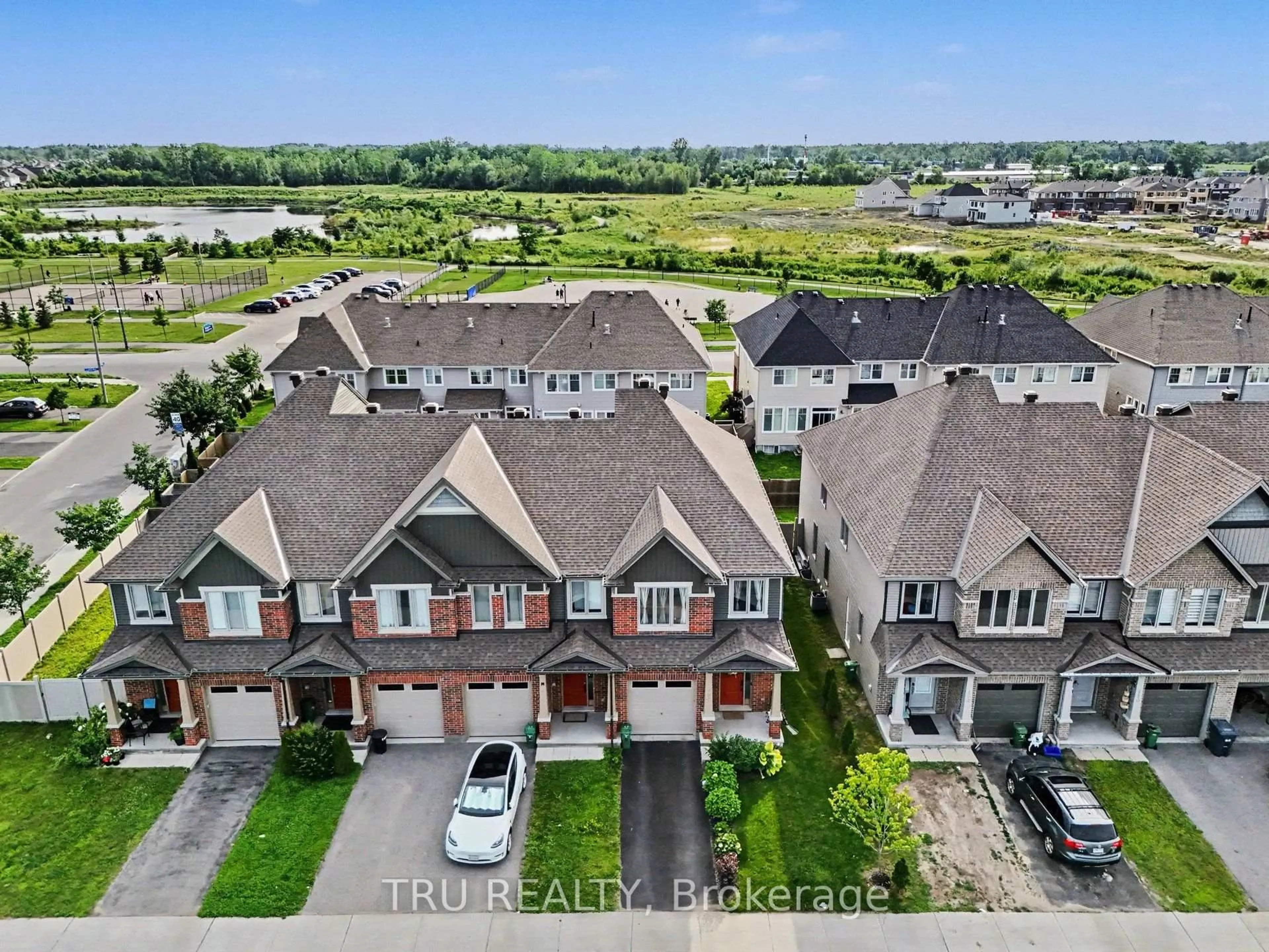A pic from outside/outdoor area/front of a property/back of a property/a pic from drone, unknown for 106 Lavatera St, Ottawa Ontario K1T 0R7