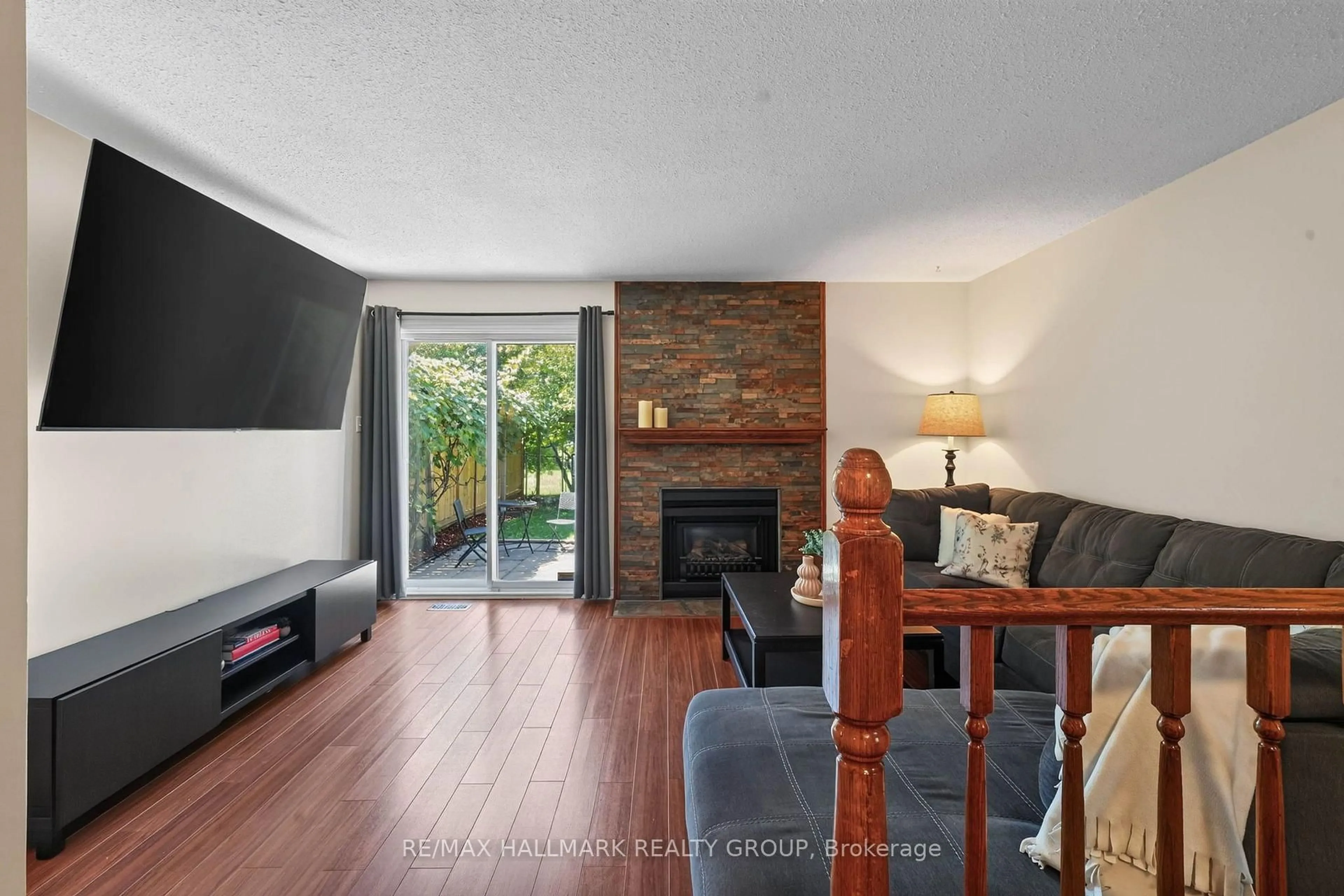 Living room with furniture, wood/laminate floor for 385 Princess Louise Dr, Orleans Ontario K4A 2K5