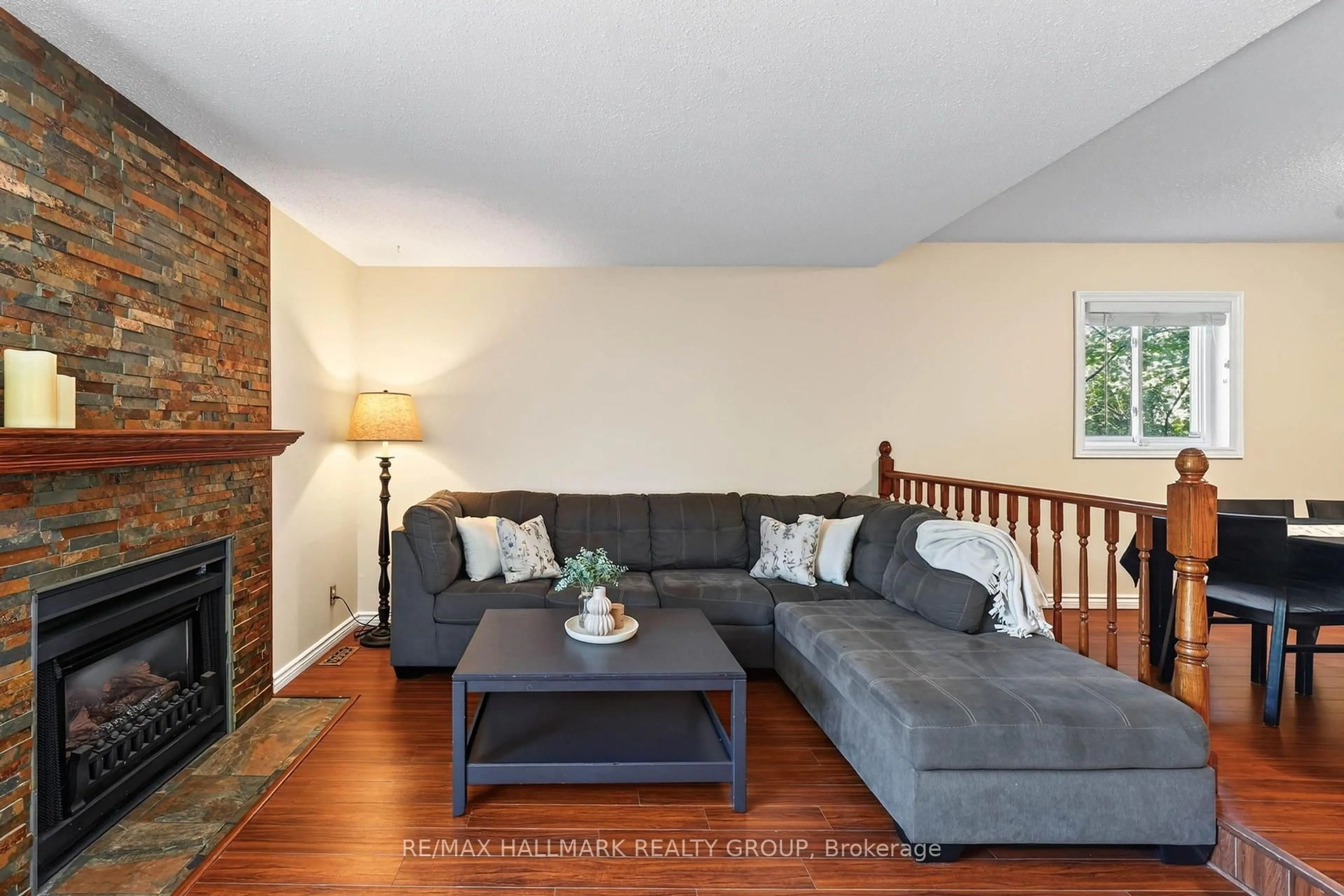 Living room with furniture, wood/laminate floor for 385 Princess Louise Dr, Orleans Ontario K4A 2K5