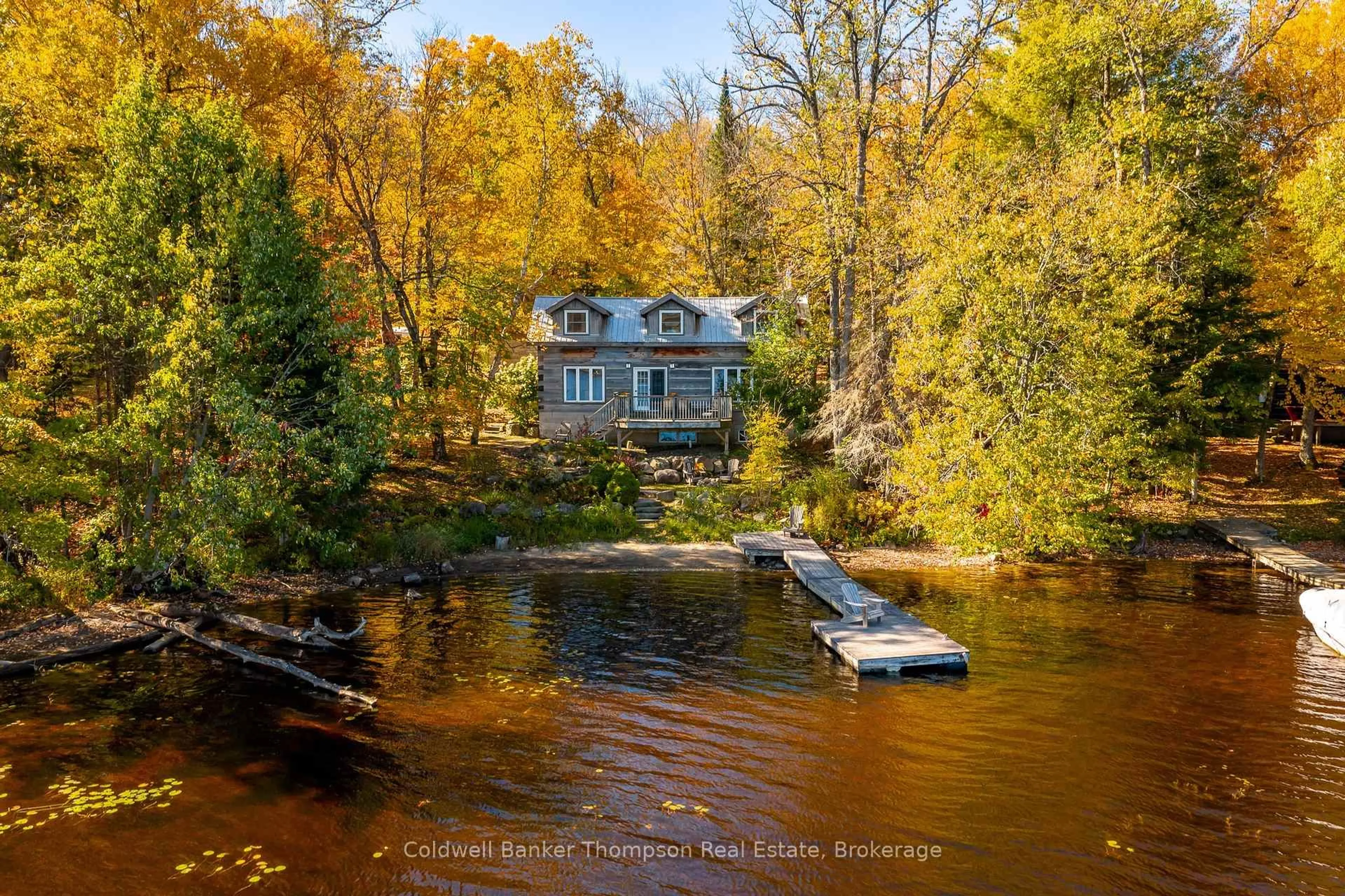 A pic from outside/outdoor area/front of a property/back of a property/a pic from drone, water/lake/river/ocean view for 18 Port Vernon Lane, Huntsville Ontario P1H 2J2