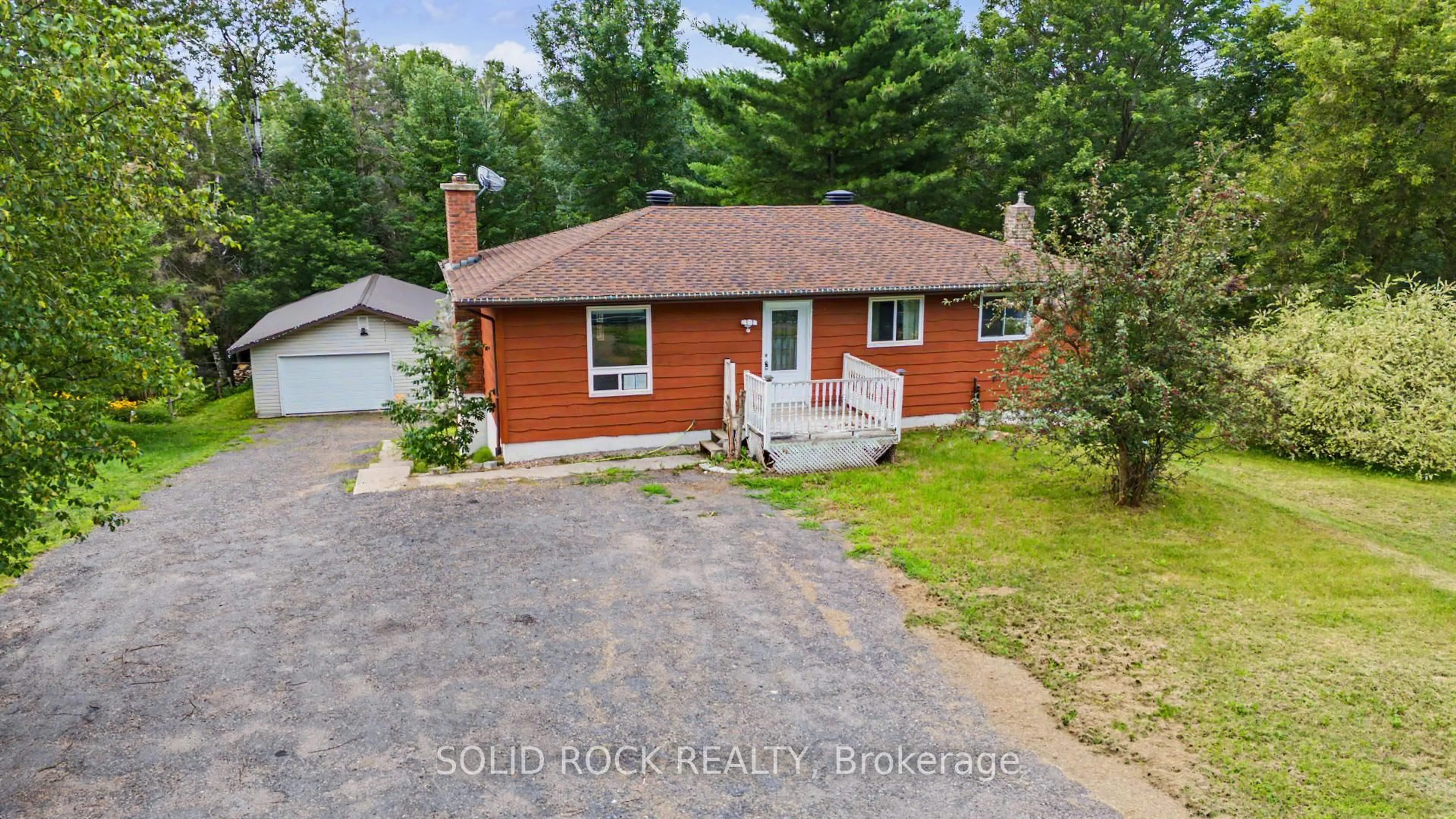 A pic from outside/outdoor area/front of a property/back of a property/a pic from drone, street for 1372 VILLAGE Rd, East Ferris Ontario P0H 1B0