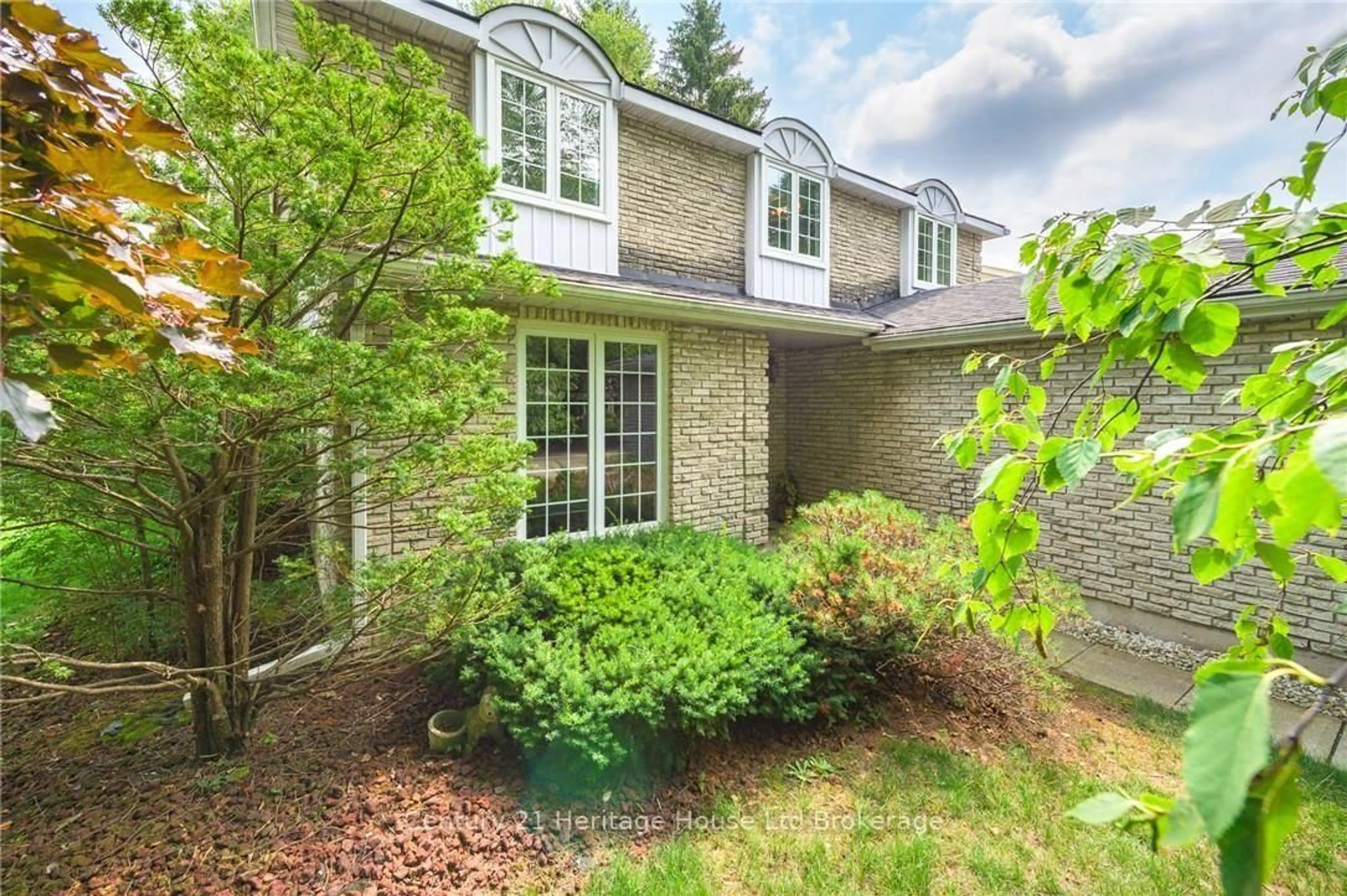 Home with brick exterior material, street for 243 Tatlock Crt, Waterloo Ontario N2L 5Y6