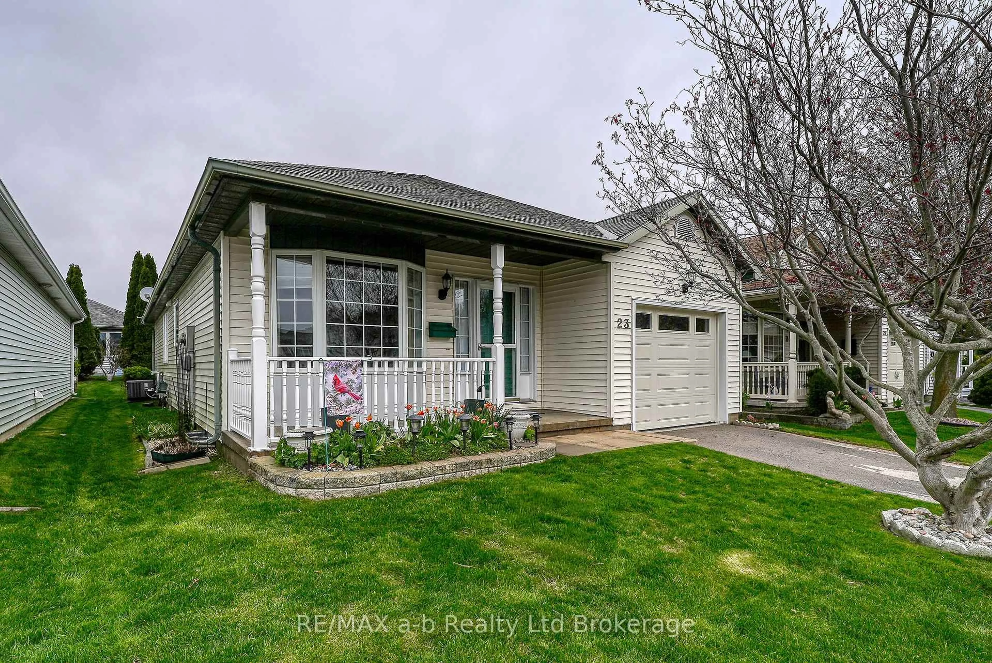 Home with vinyl exterior material, street for 23 Brasher Dr, Tillsonburg Ontario N4G 5T2
