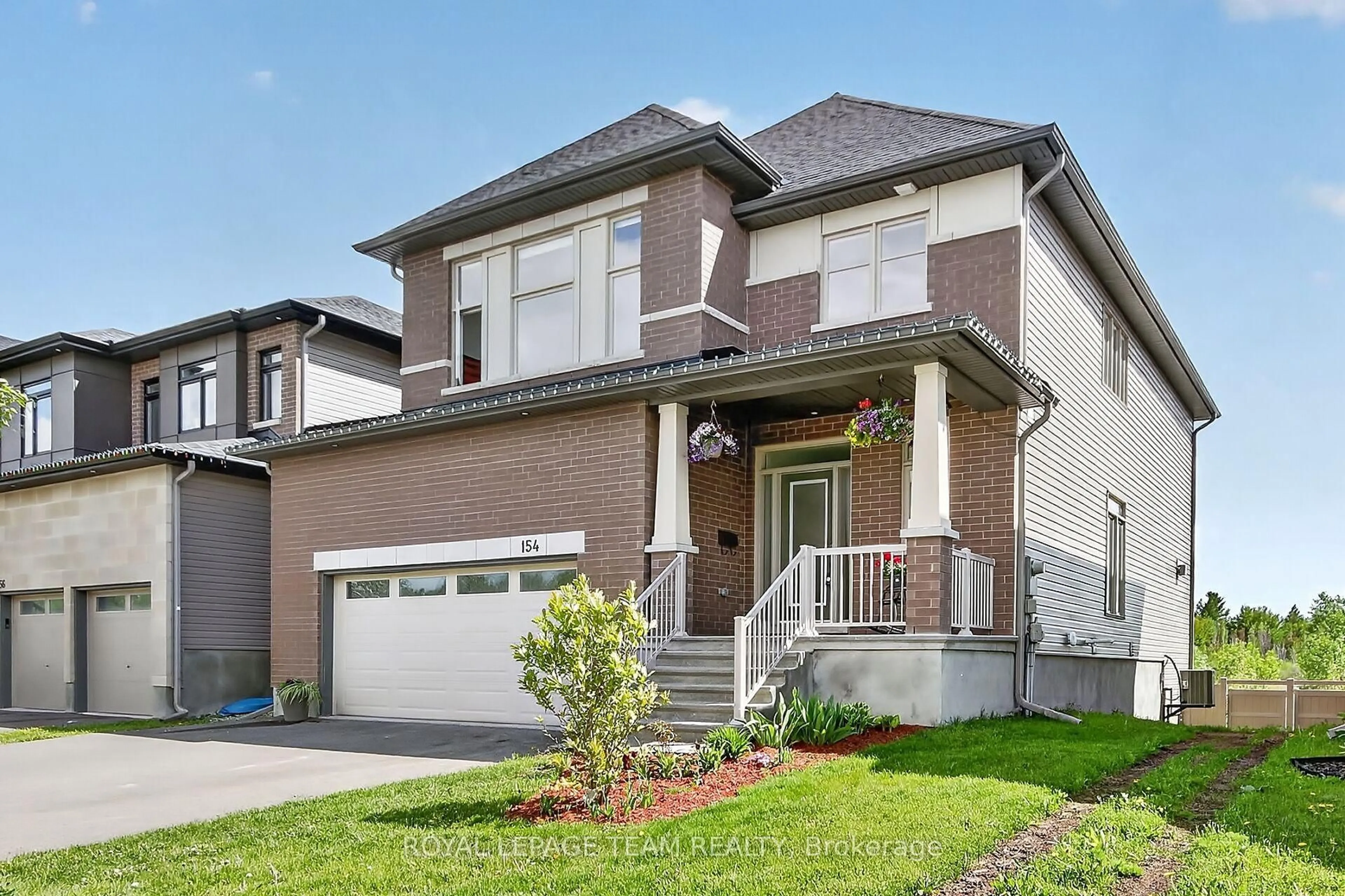 Home with brick exterior material, street for 154 Winterhaven Dr, Orleans Ontario K1W 0P1
