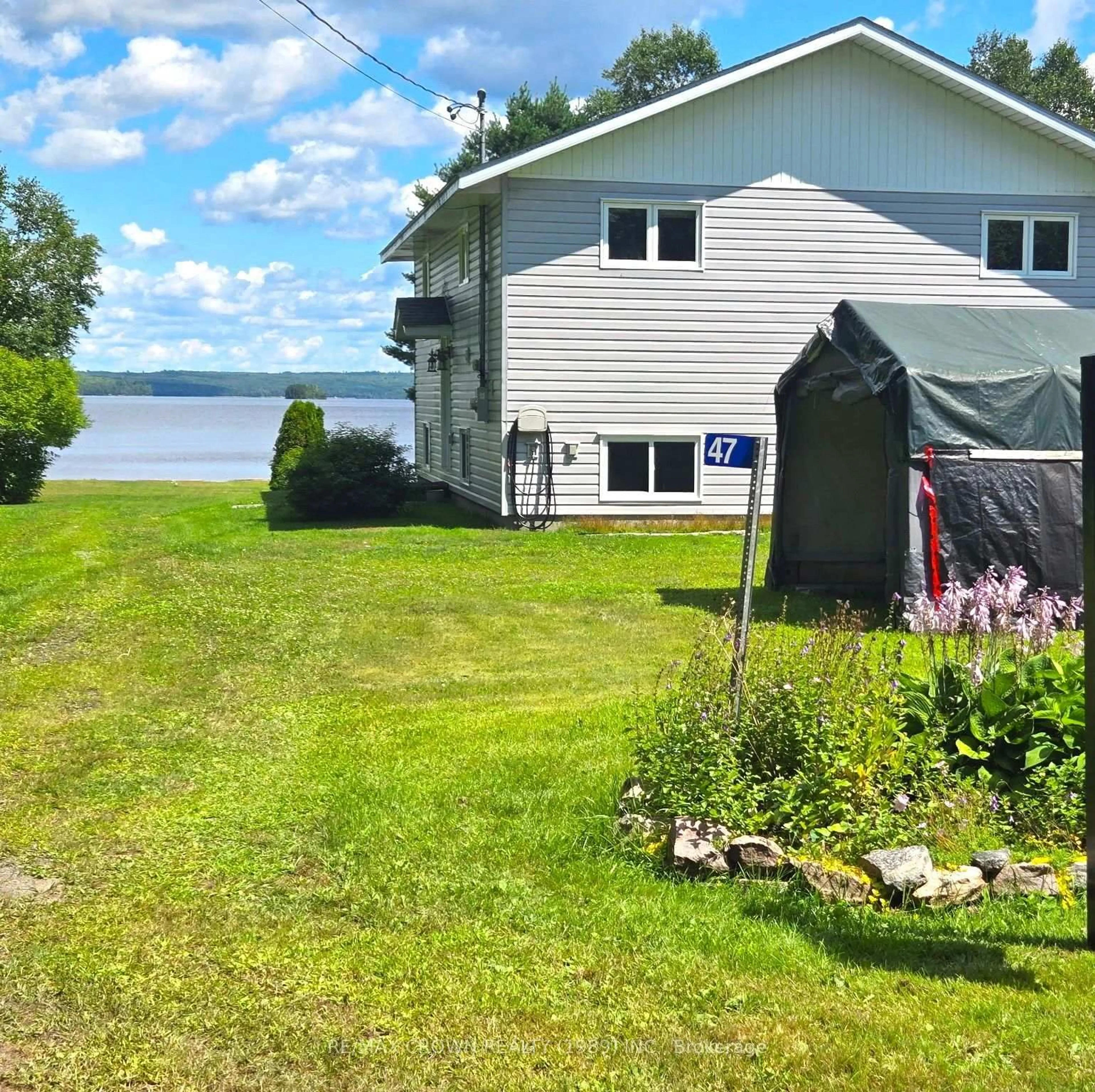 A pic from outside/outdoor area/front of a property/back of a property/a pic from drone, water/lake/river/ocean view for 47 Sandy Point Rd, West Nipissing Ontario P0H 1L0