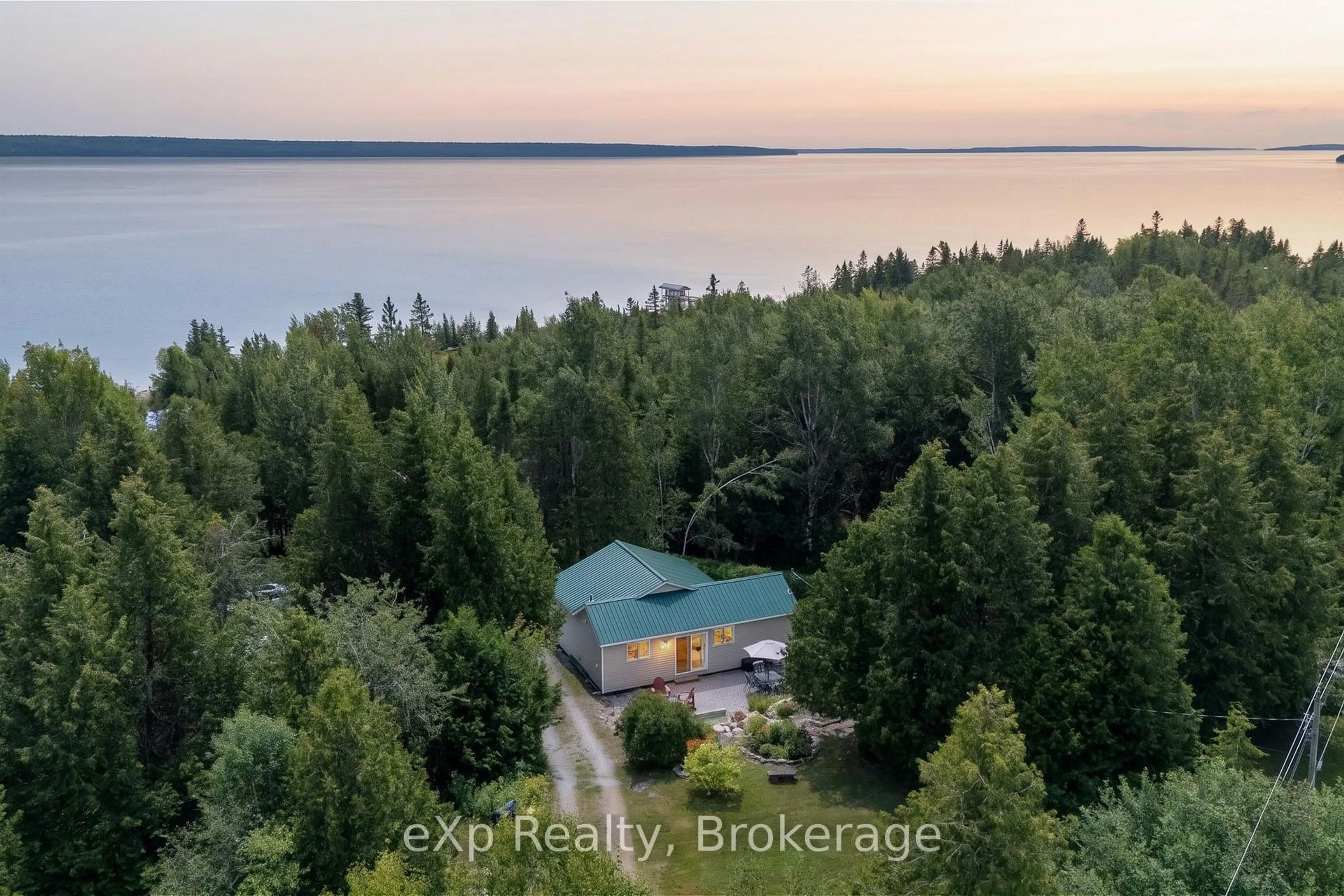 A pic from outside/outdoor area/front of a property/back of a property/a pic from drone, water/lake/river/ocean view for 284 Leask Bay Shores Manitowaning Lane, Assiginack Ontario P0P 1N0
