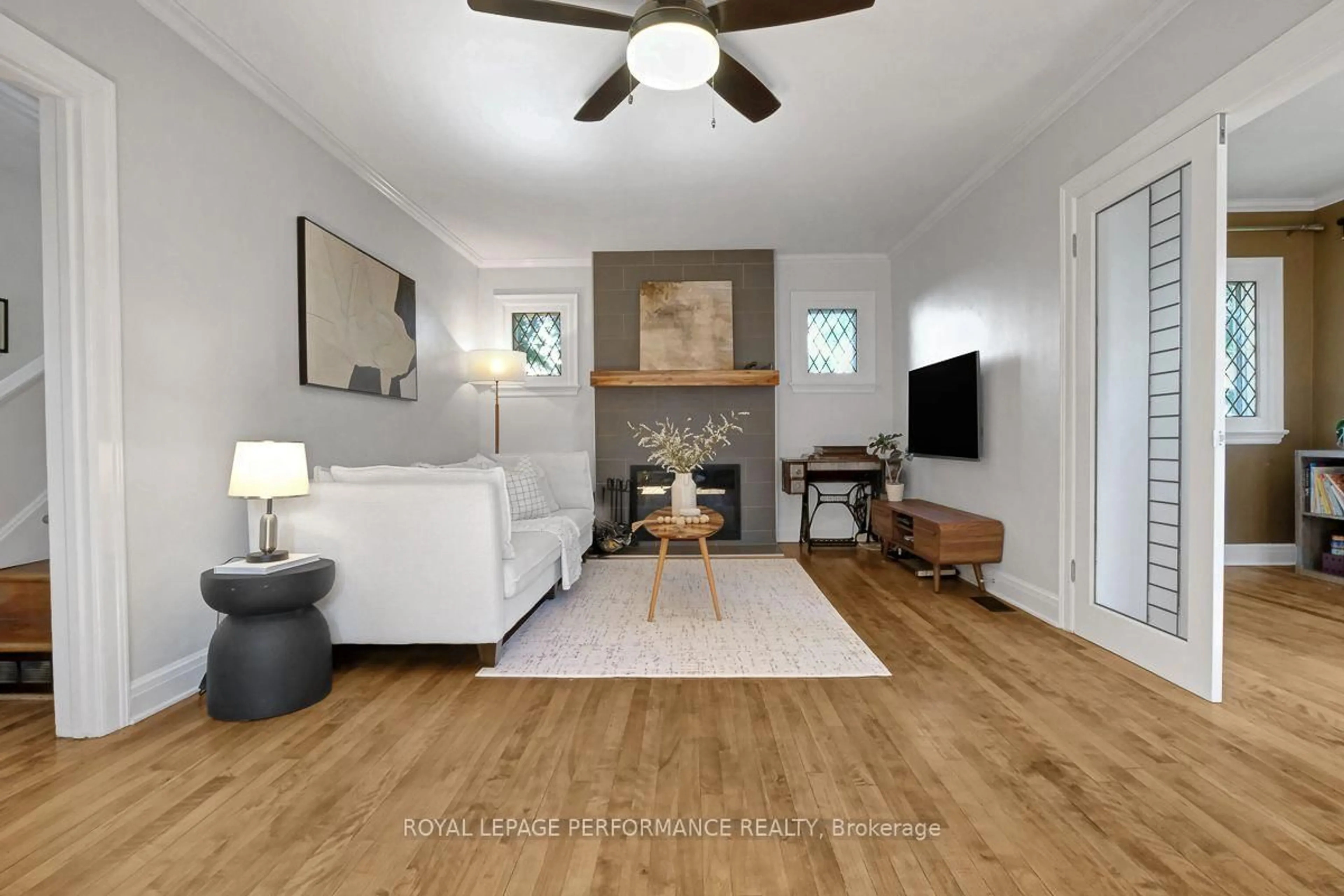 Living room with furniture, wood/laminate floor for 13 Wolff St, Ottawa Ontario K1K 1K6