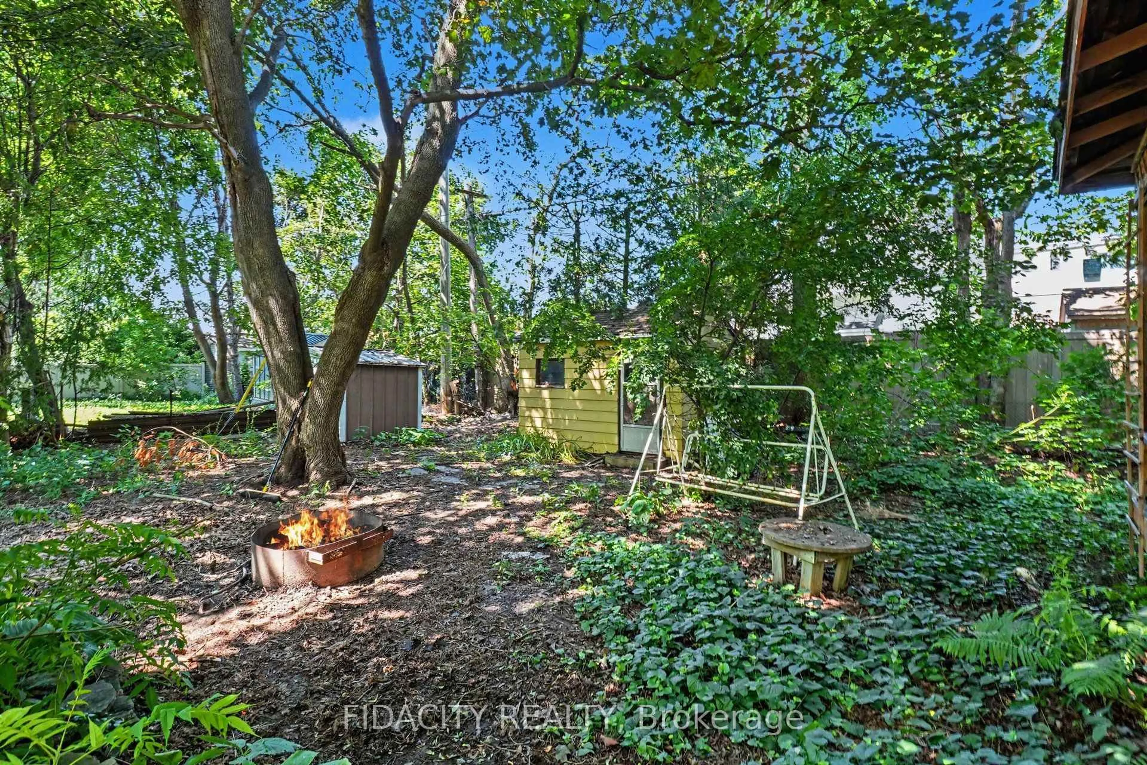 A pic from outside/outdoor area/front of a property/back of a property/a pic from drone, forest/trees view for 6 Malcolm Pl, Ottawa Ontario K2G 1P4