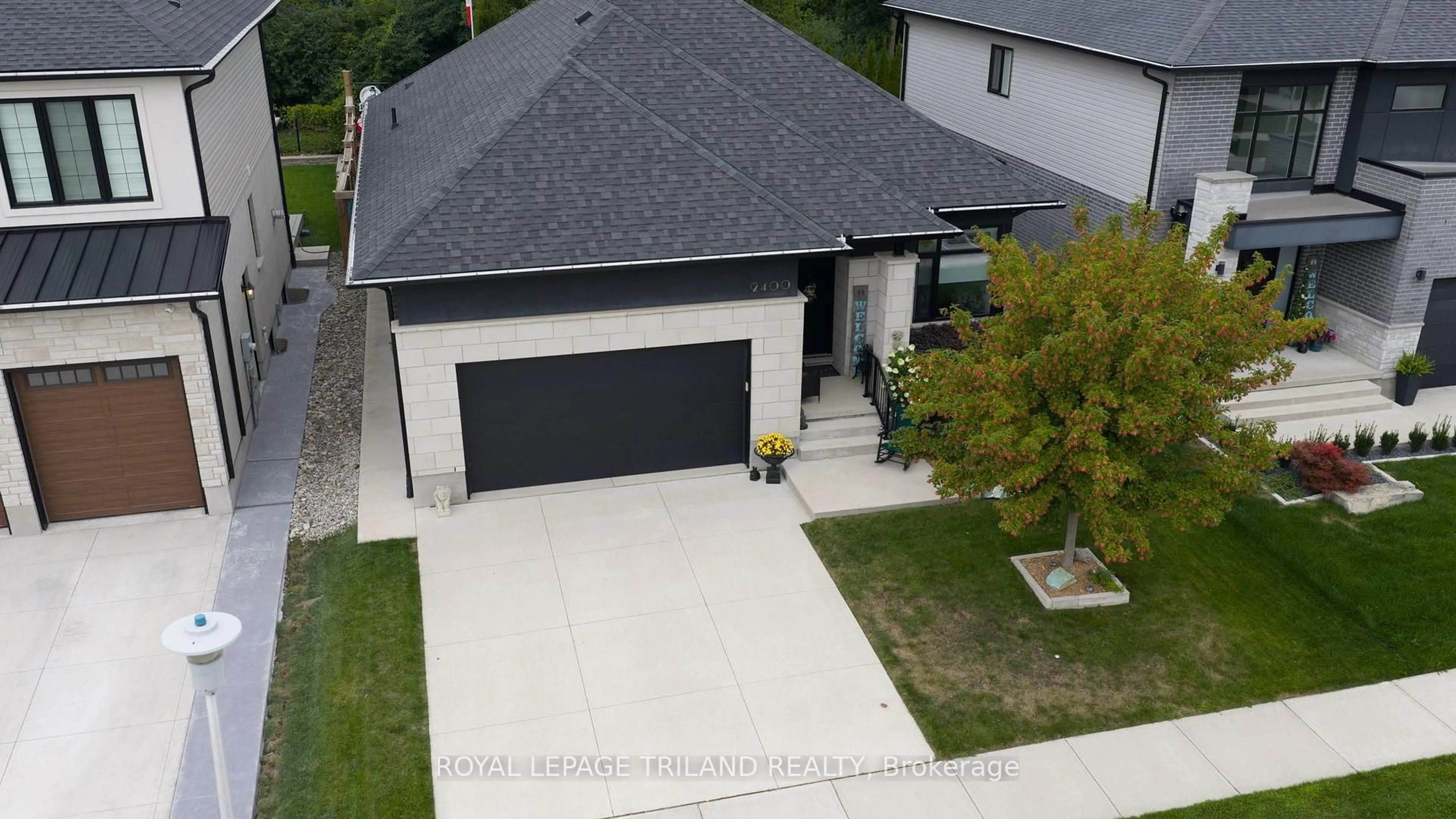 A pic from outside/outdoor area/front of a property/back of a property/a pic from drone, street for 2400 Red Thorne Ave, London South Ontario N6P 0E6