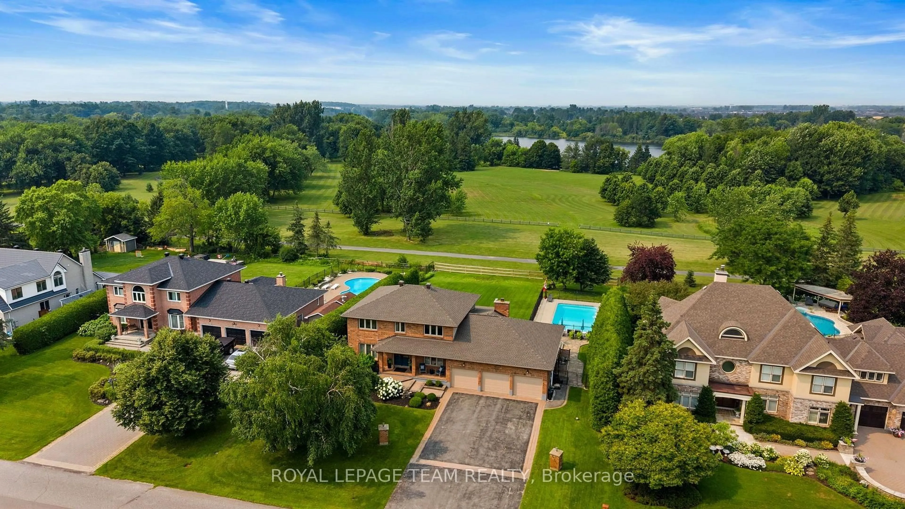 A pic from outside/outdoor area/front of a property/back of a property/a pic from drone, water/lake/river/ocean view for 1095 Bravar Dr, Manotick Ontario K4M 1G2