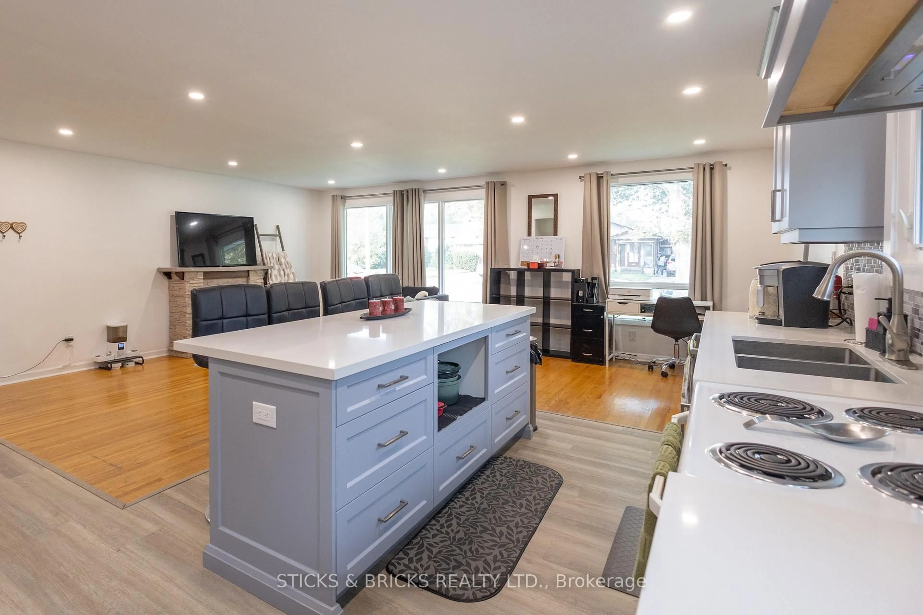 Open concept kitchen, wood/laminate floor for 4479 Mitchell Ave, Niagara Falls Ontario L2E 6R6