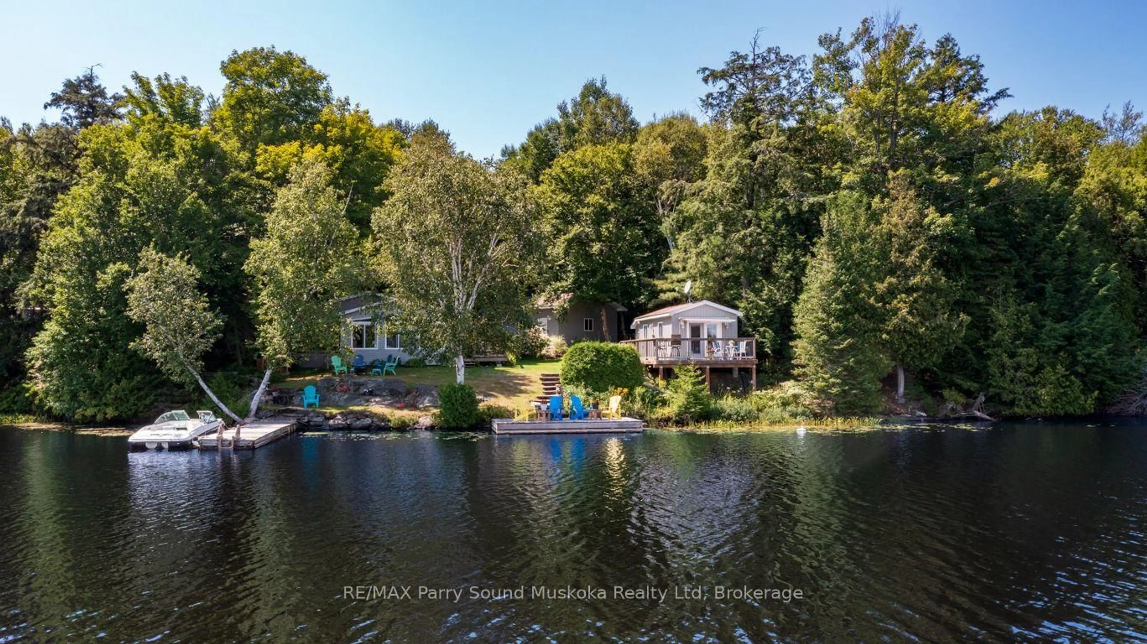 A pic from outside/outdoor area/front of a property/back of a property/a pic from drone, water/lake/river/ocean view for 18 Maple Tr, McDougall Ontario P2A 2W7