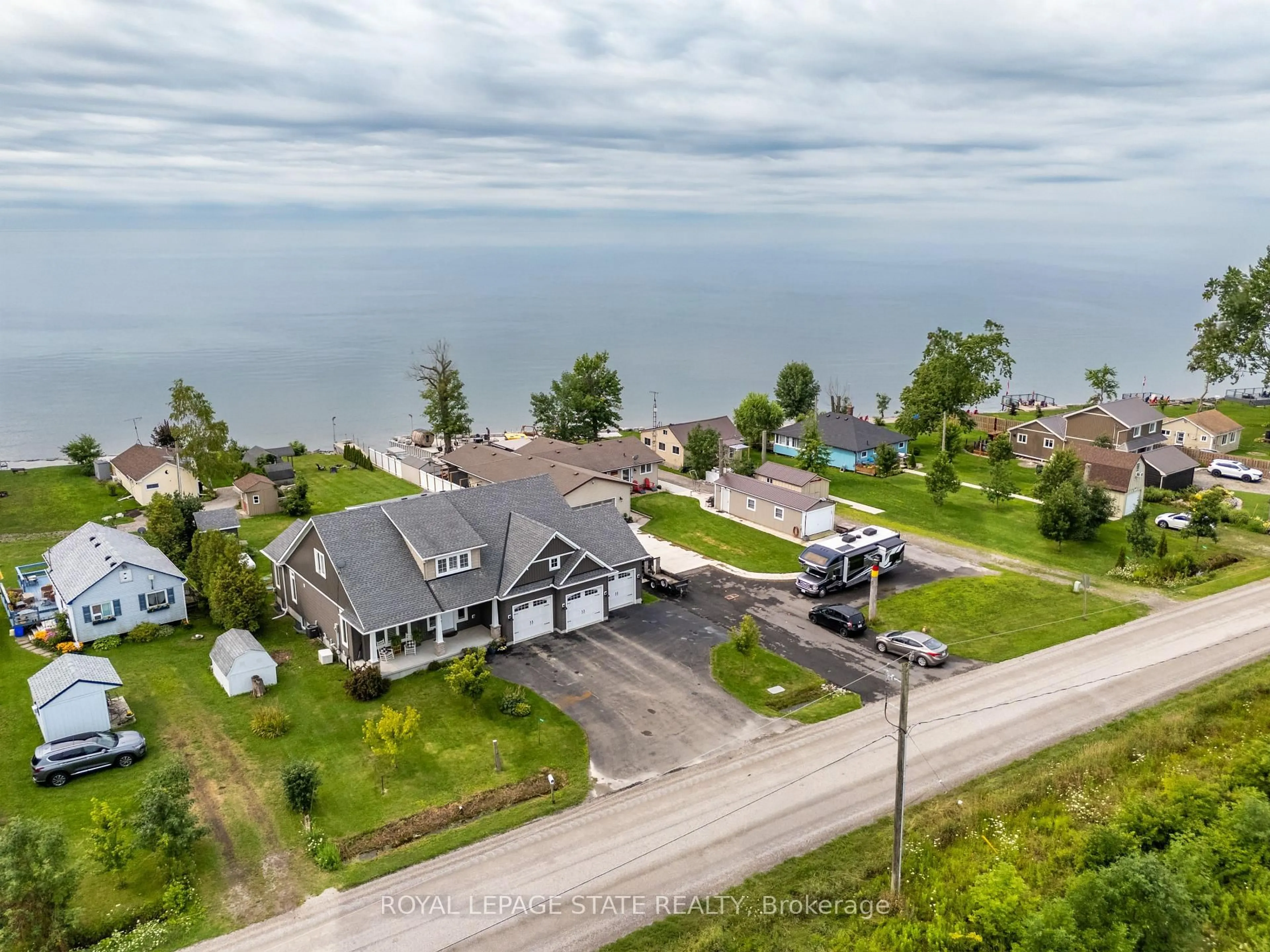 A pic from outside/outdoor area/front of a property/back of a property/a pic from drone, water/lake/river/ocean view for 3176 Lakeshore Rd, Haldimand Ontario N1A 2W8