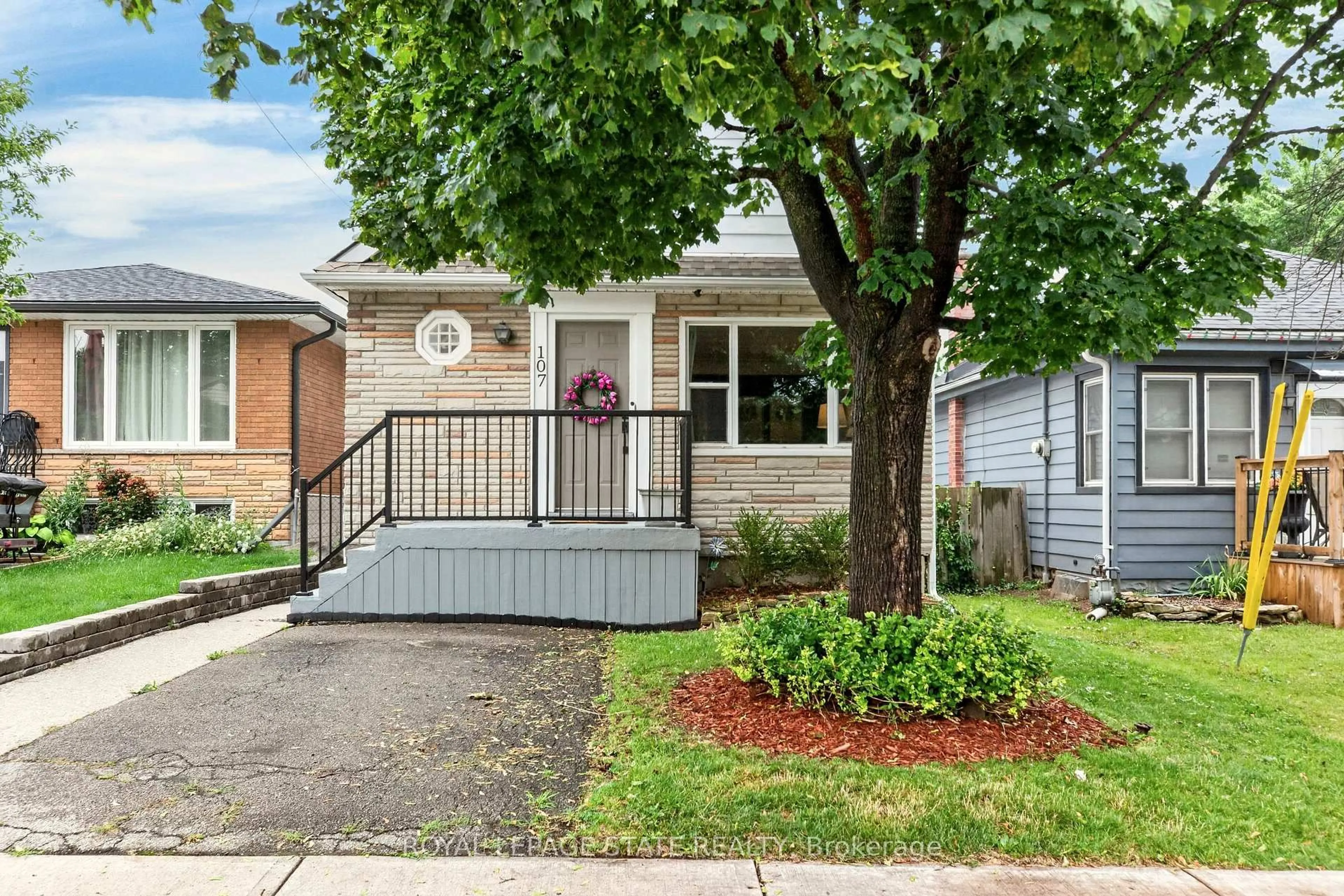 Home with brick exterior material, street for 107 Reid Ave, Hamilton Ontario L8H 6E2