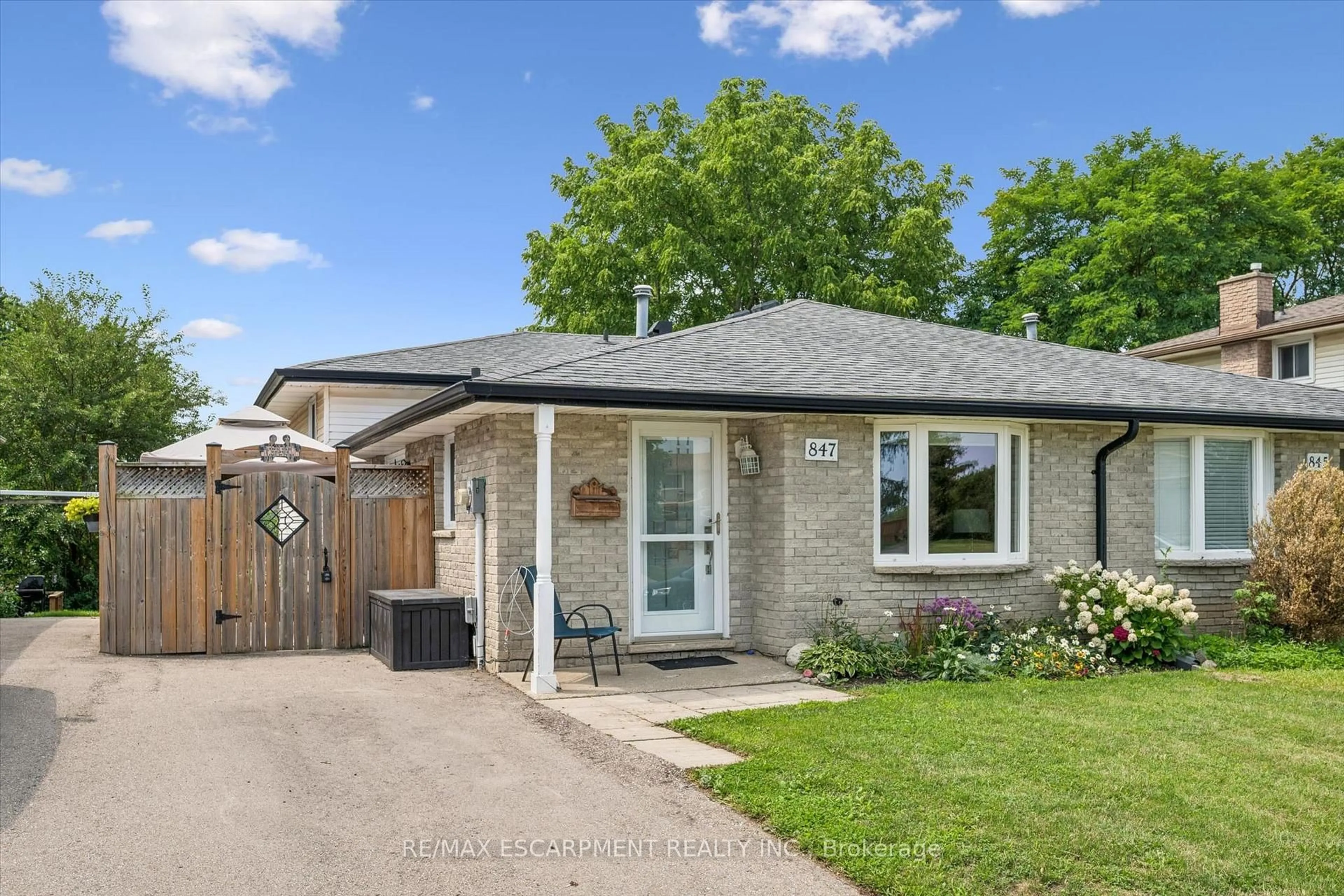 Home with brick exterior material, street for 847 Doon Village Rd, Kitchener Ontario N2P 1A1