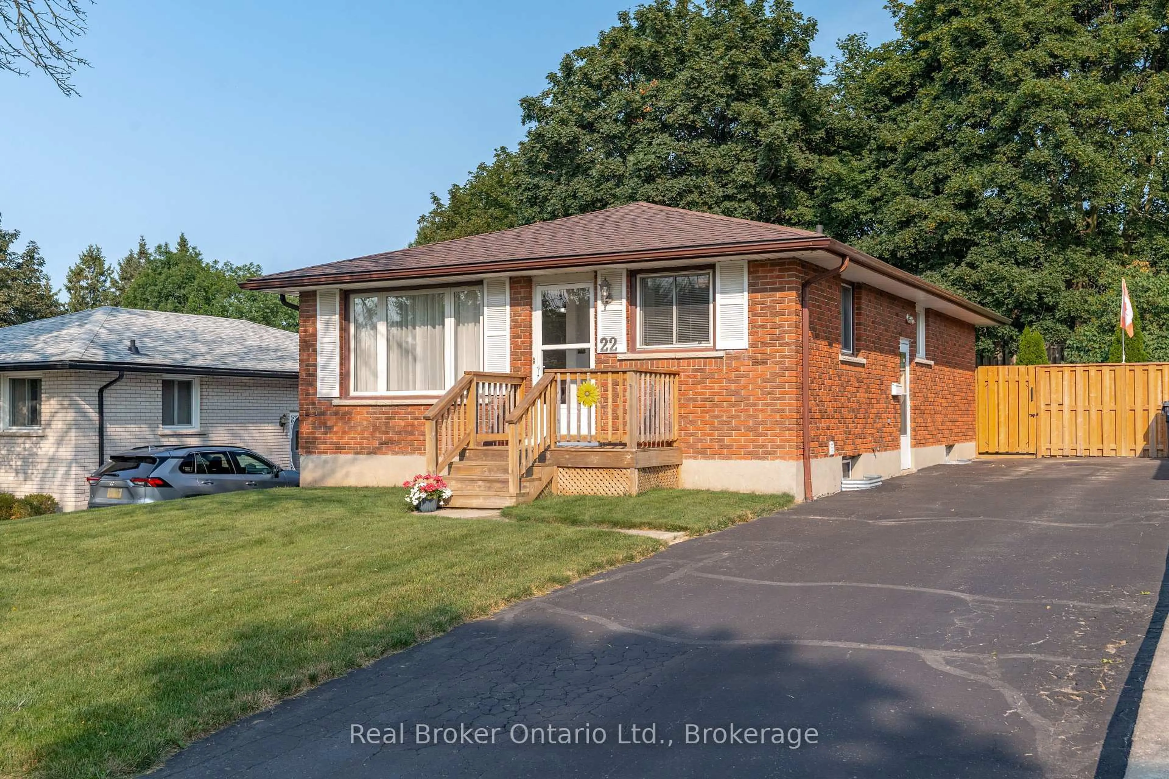 Home with brick exterior material, street for 22 Mountford Dr, Guelph Ontario N1E 6E9