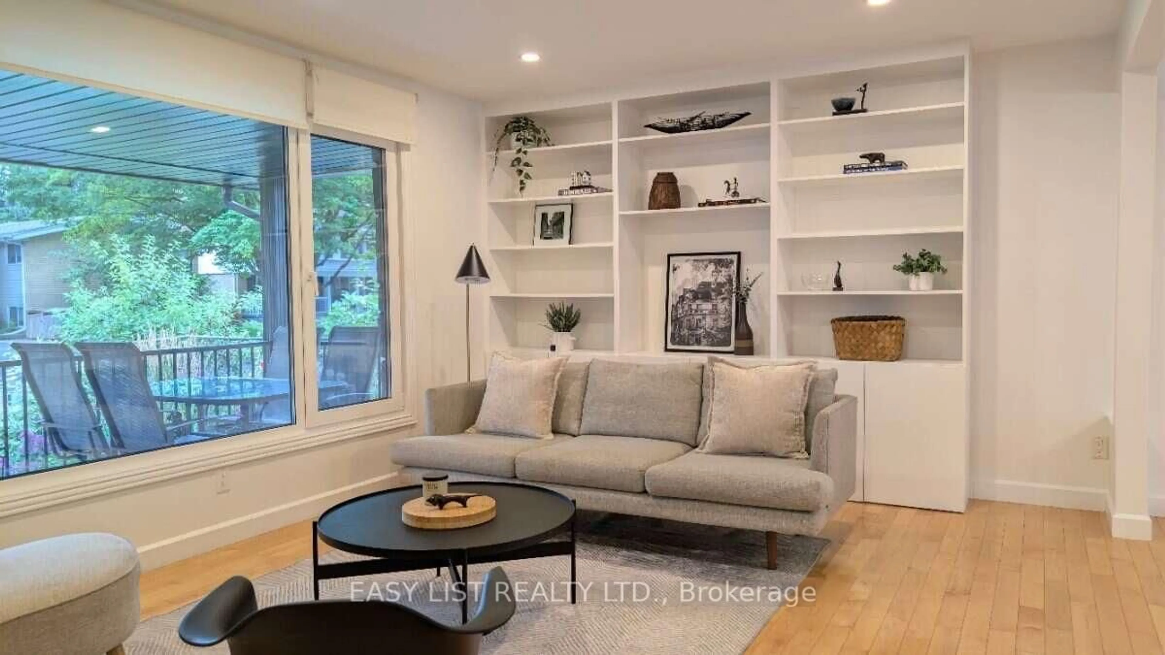 Living room with furniture, wood/laminate floor for 1895 Savoy Pl, Ottawa Ontario K2C 0W2