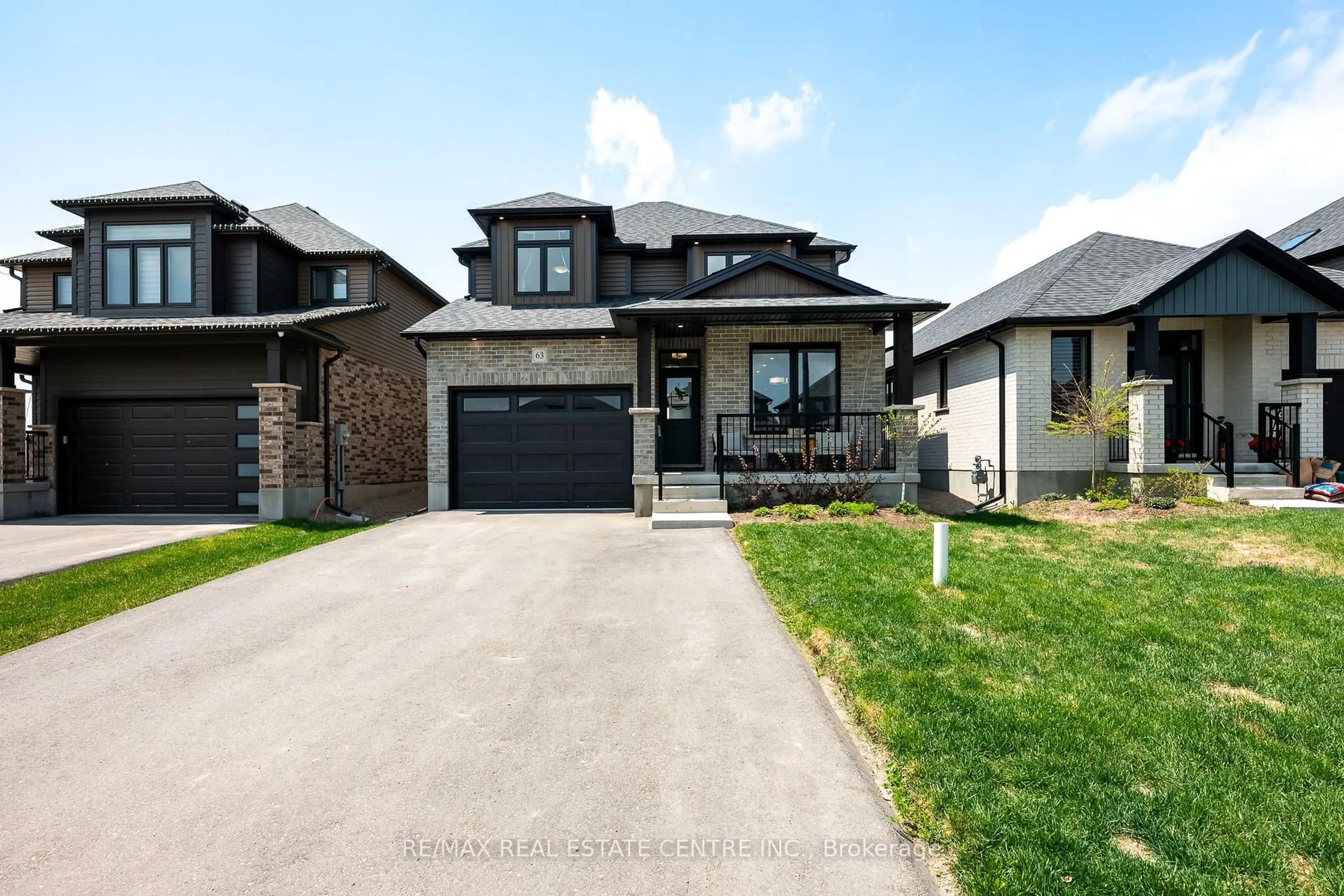 Home with brick exterior material, street for 63 Melody Lane, East Luther Grand Valley Ontario L9W 7S8