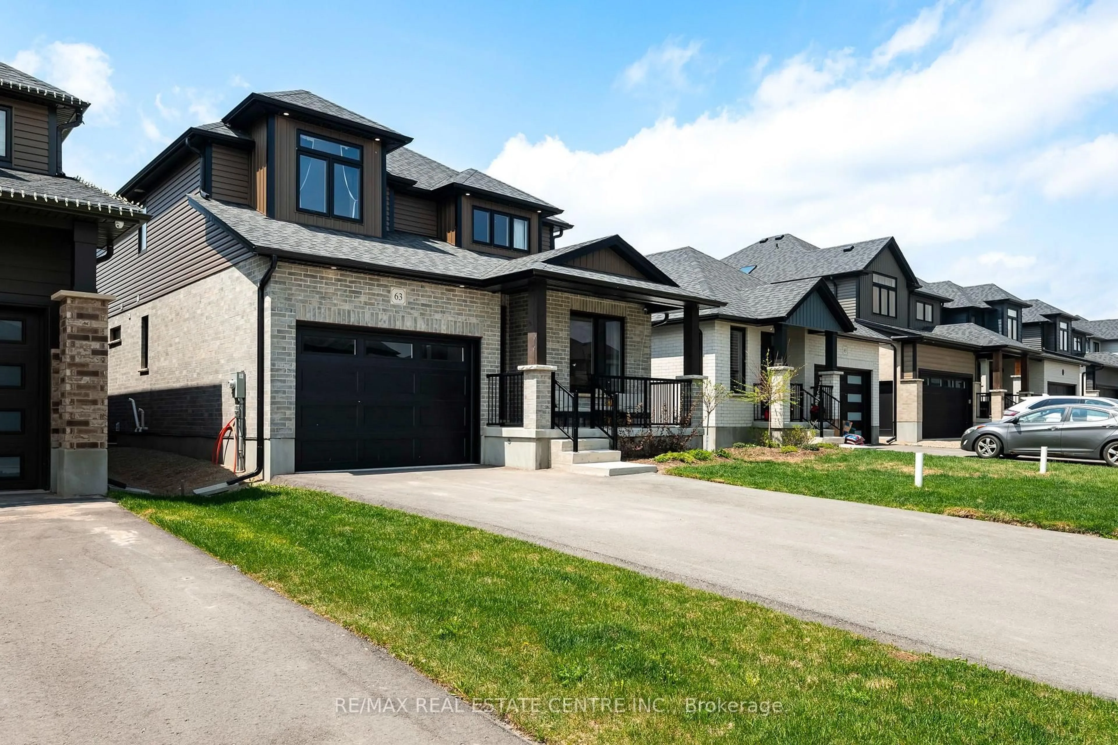 Home with brick exterior material, street for 63 Melody Lane, East Luther Grand Valley Ontario L9W 7S8