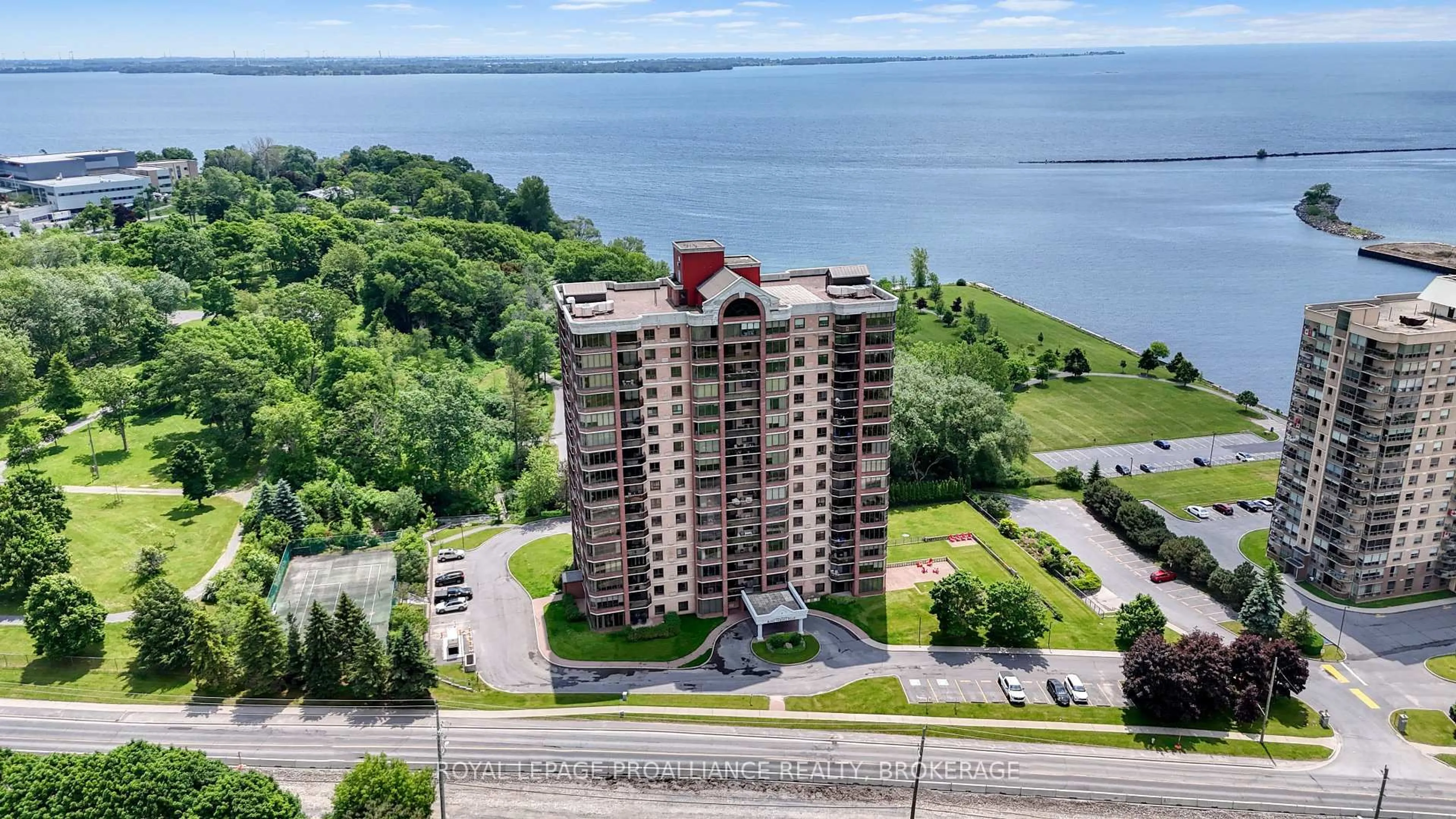 A pic from outside/outdoor area/front of a property/back of a property/a pic from drone, water/lake/river/ocean view for 1000 King St #305, Kingston Ontario K7M 8H3