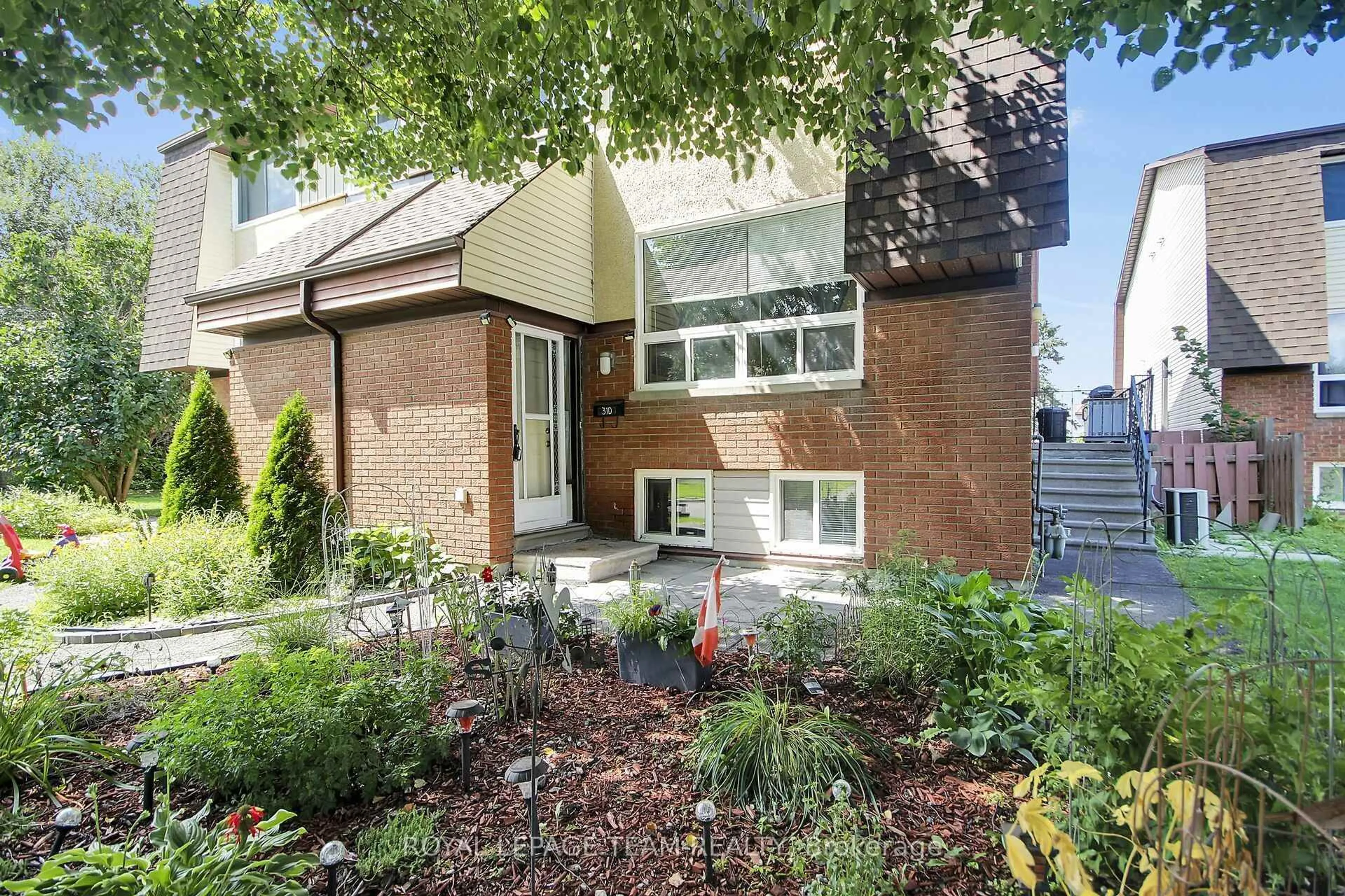 Home with brick exterior material, street for 31 Woodvale Green St #D, Ottawa Ontario K2G 4H3