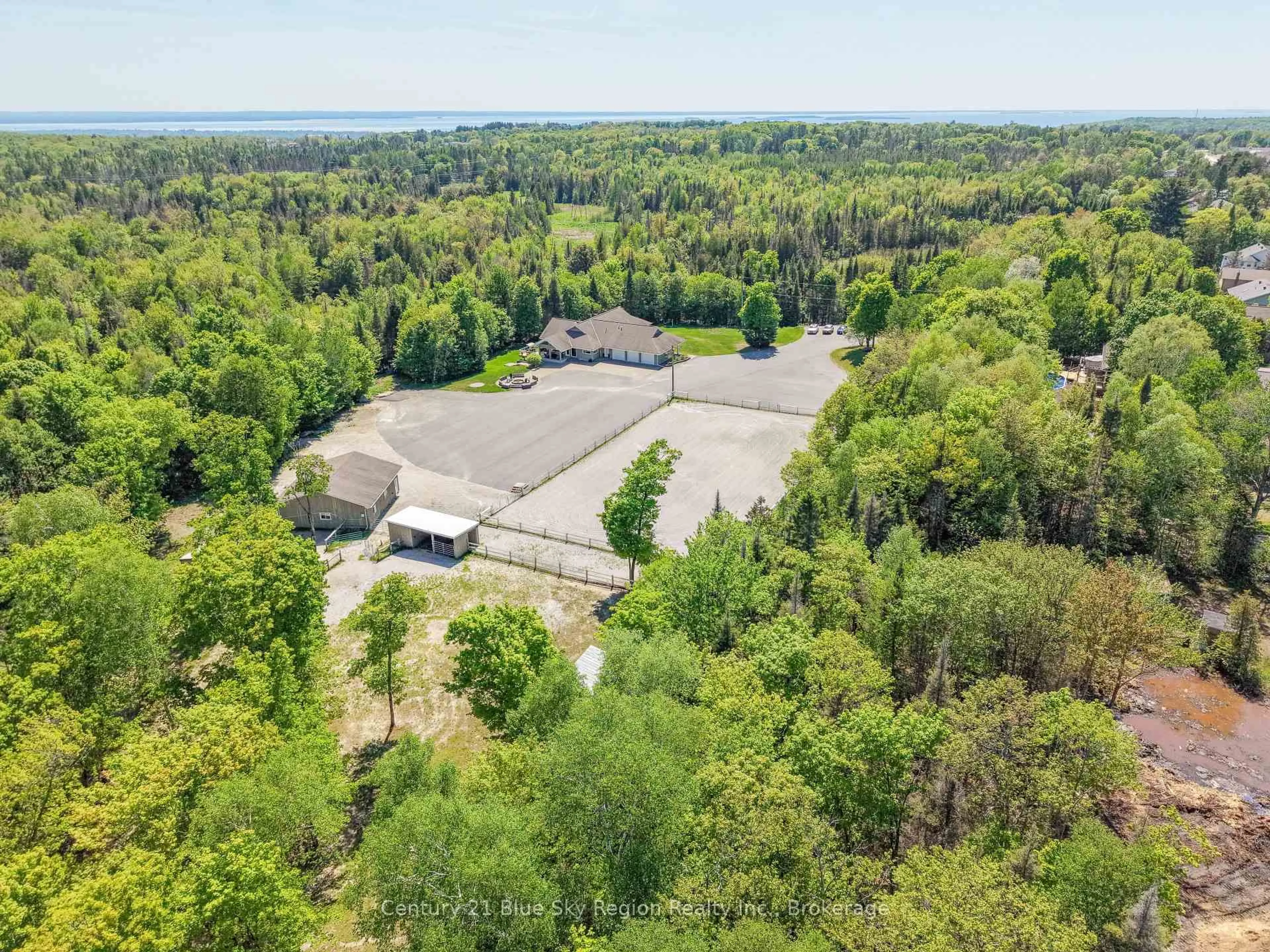 A pic from outside/outdoor area/front of a property/back of a property/a pic from drone, forest/trees view for 395 Carmichael Dr, North Bay Ontario P1B 8G2