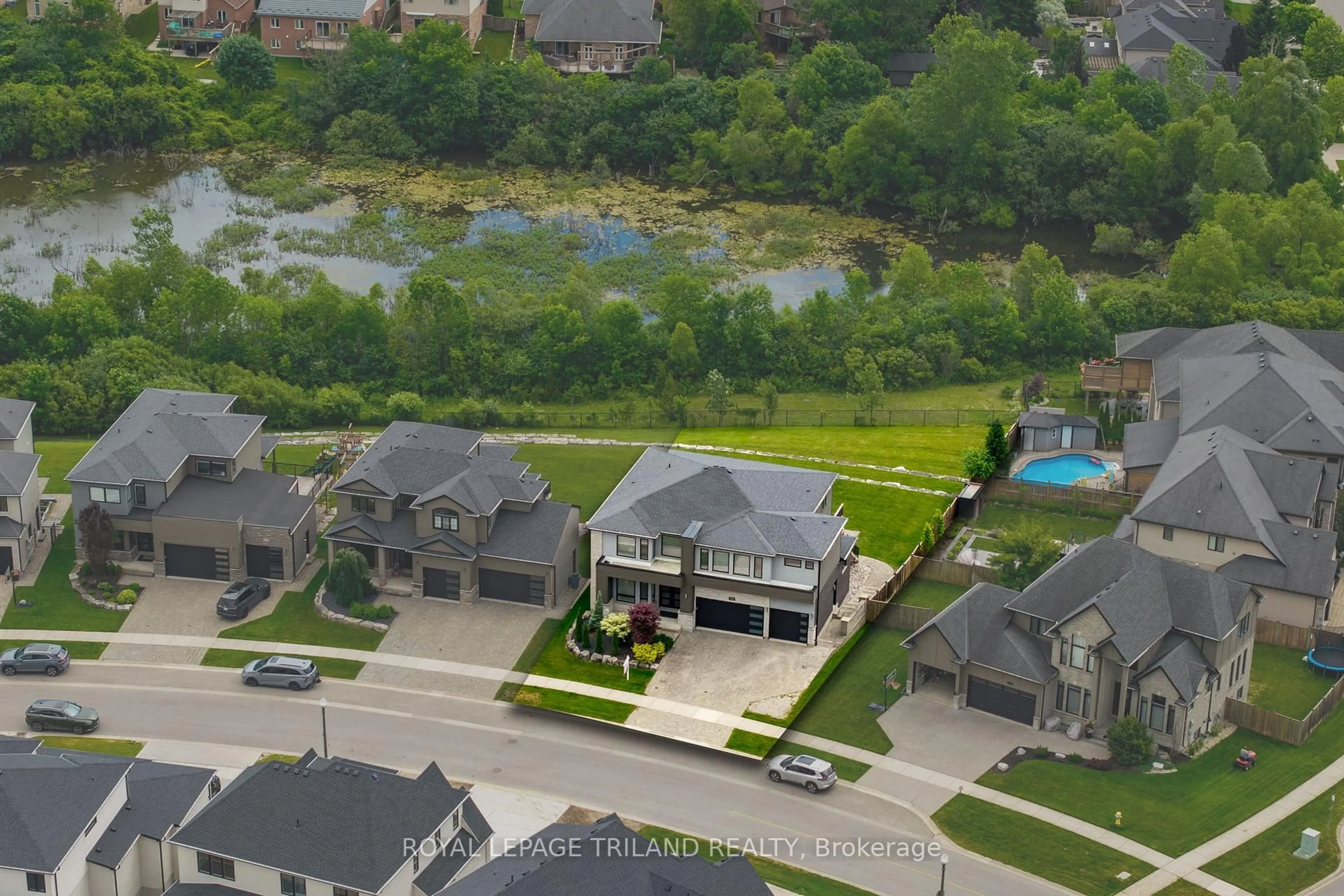 A pic from outside/outdoor area/front of a property/back of a property/a pic from drone, water/lake/river/ocean view for 1010 Longworth Rd, London South Ontario N6K 0C9