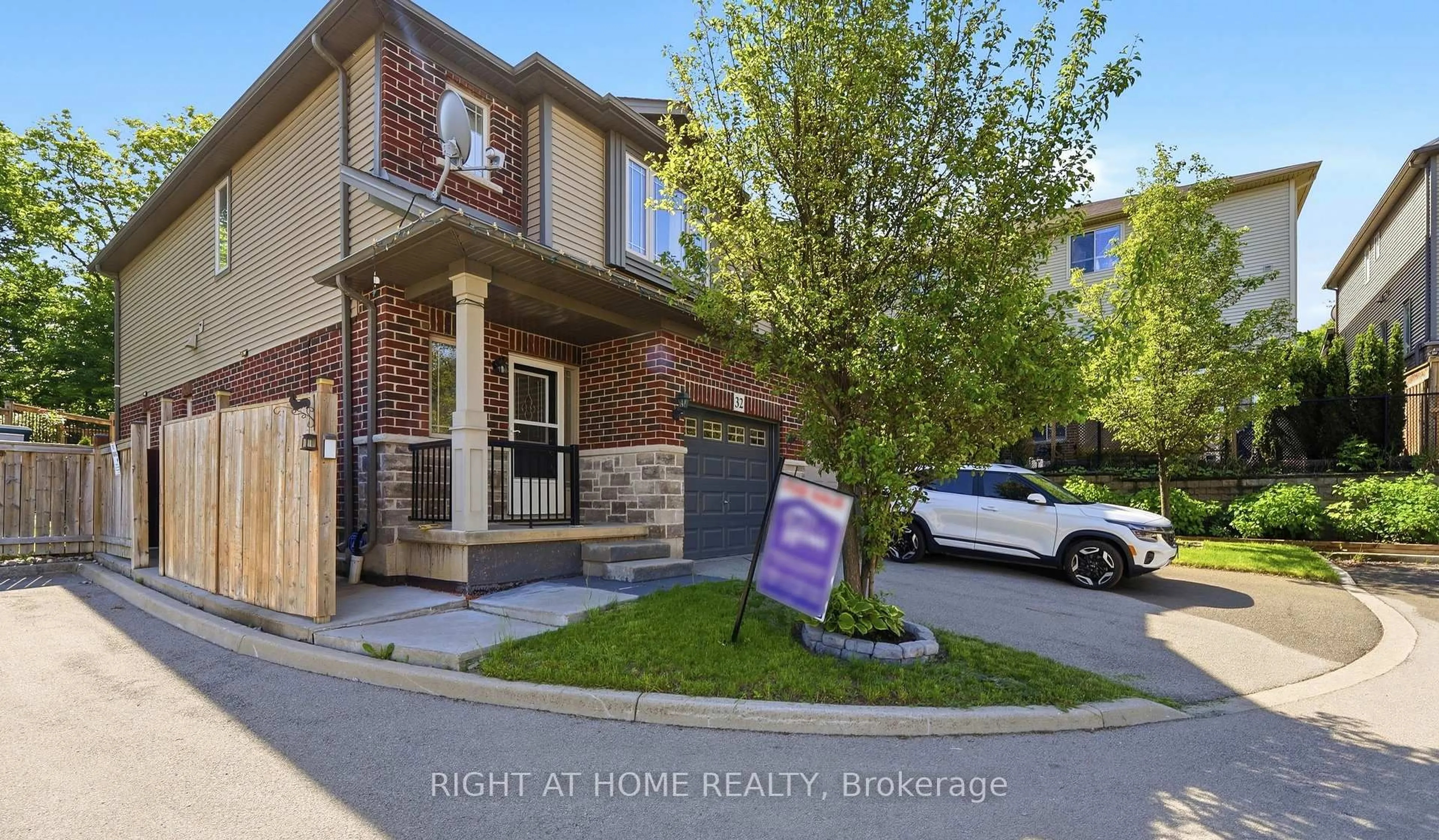 Home with brick exterior material, street for 32 Rolling Lane, Hamilton Ontario L8K 0A1