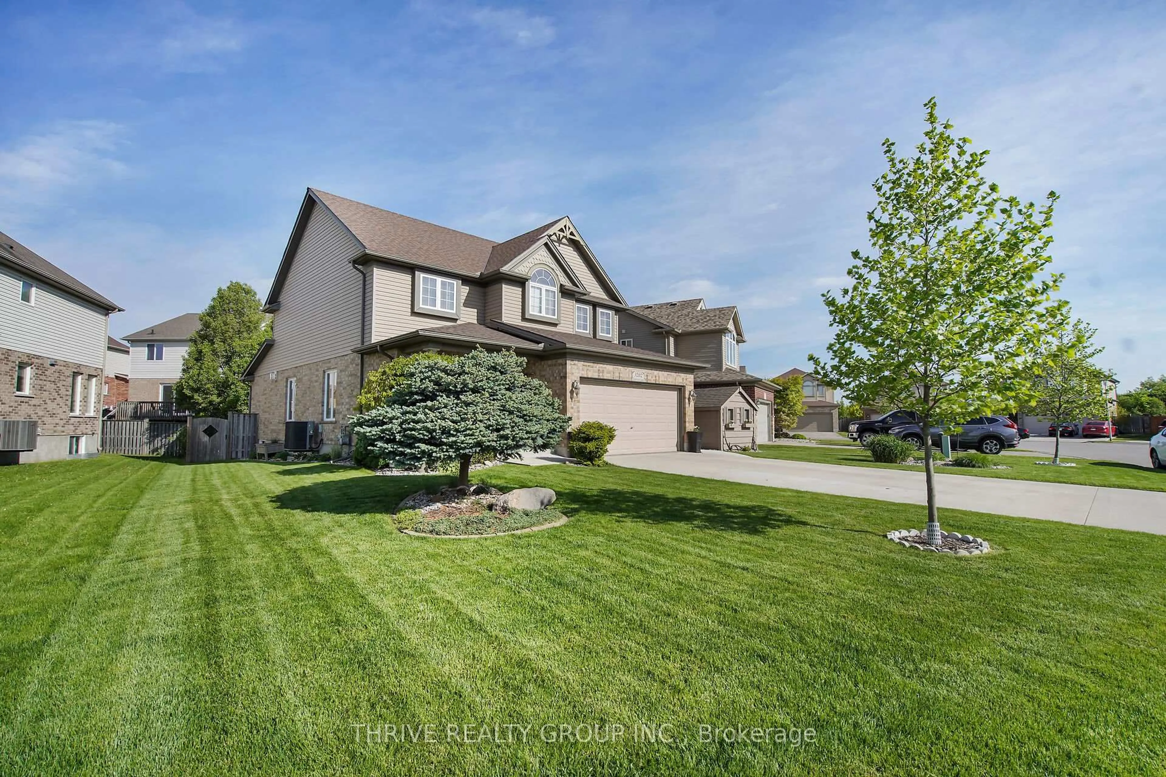 A pic from outside/outdoor area/front of a property/back of a property/a pic from drone, street for 3202 Emilycarr Lane, London South Ontario N6L 0B2