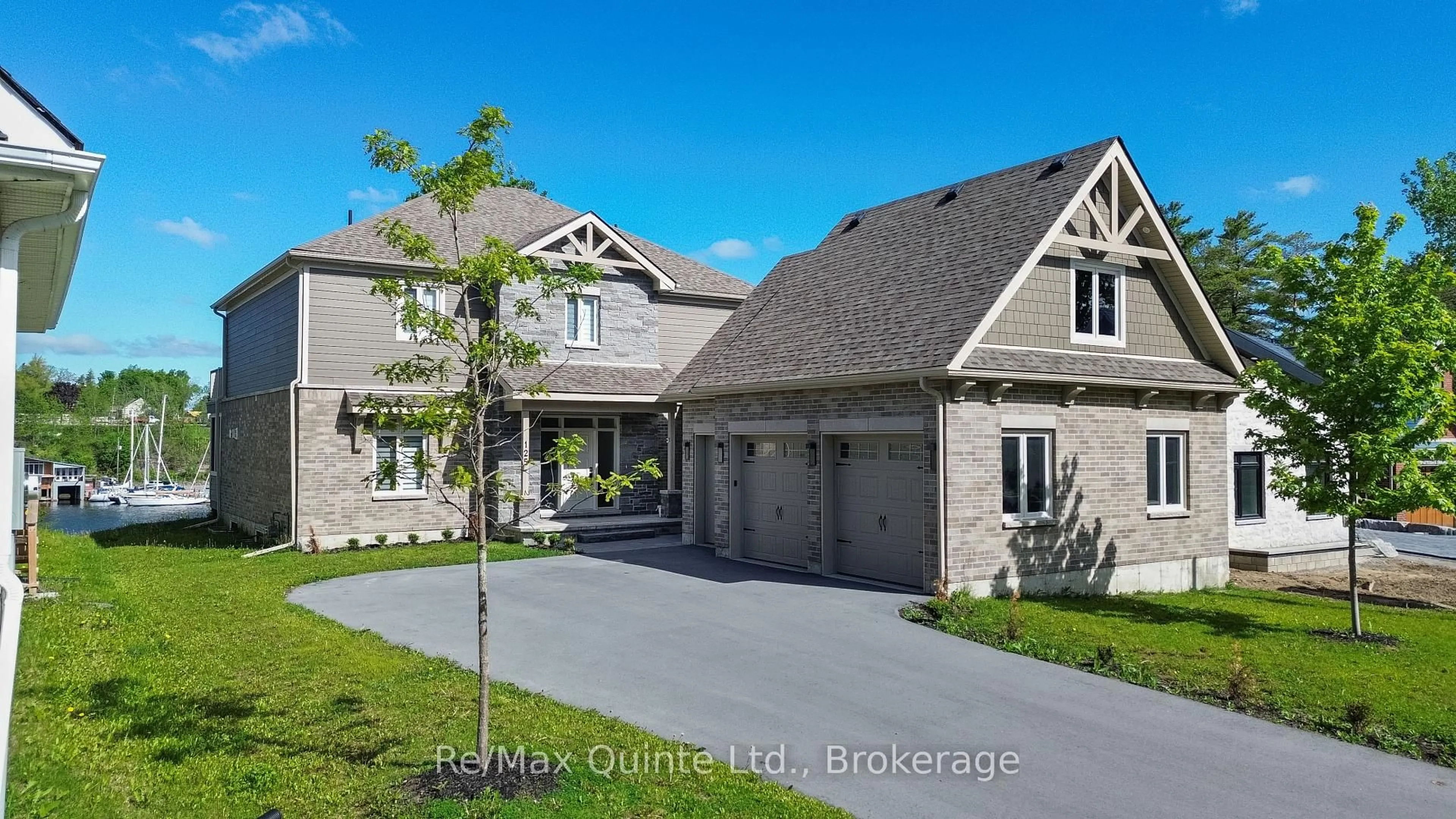 A pic from outside/outdoor area/front of a property/back of a property/a pic from drone, street for 125 Villeneuve Dr, Prince Edward County Ontario K0K 2T0