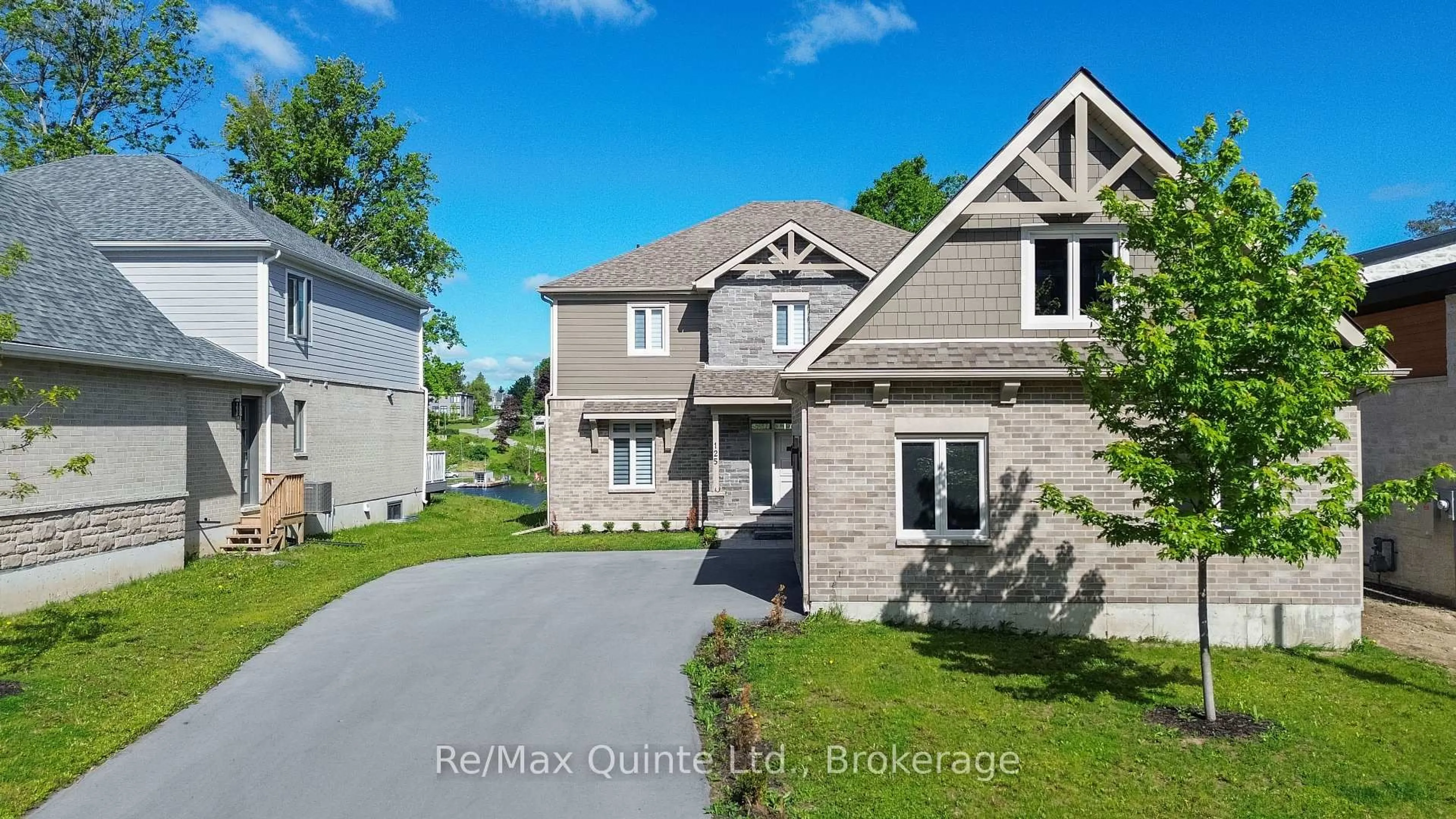 Home with brick exterior material, street for 125 Villeneuve Dr, Prince Edward County Ontario K0K 2T0