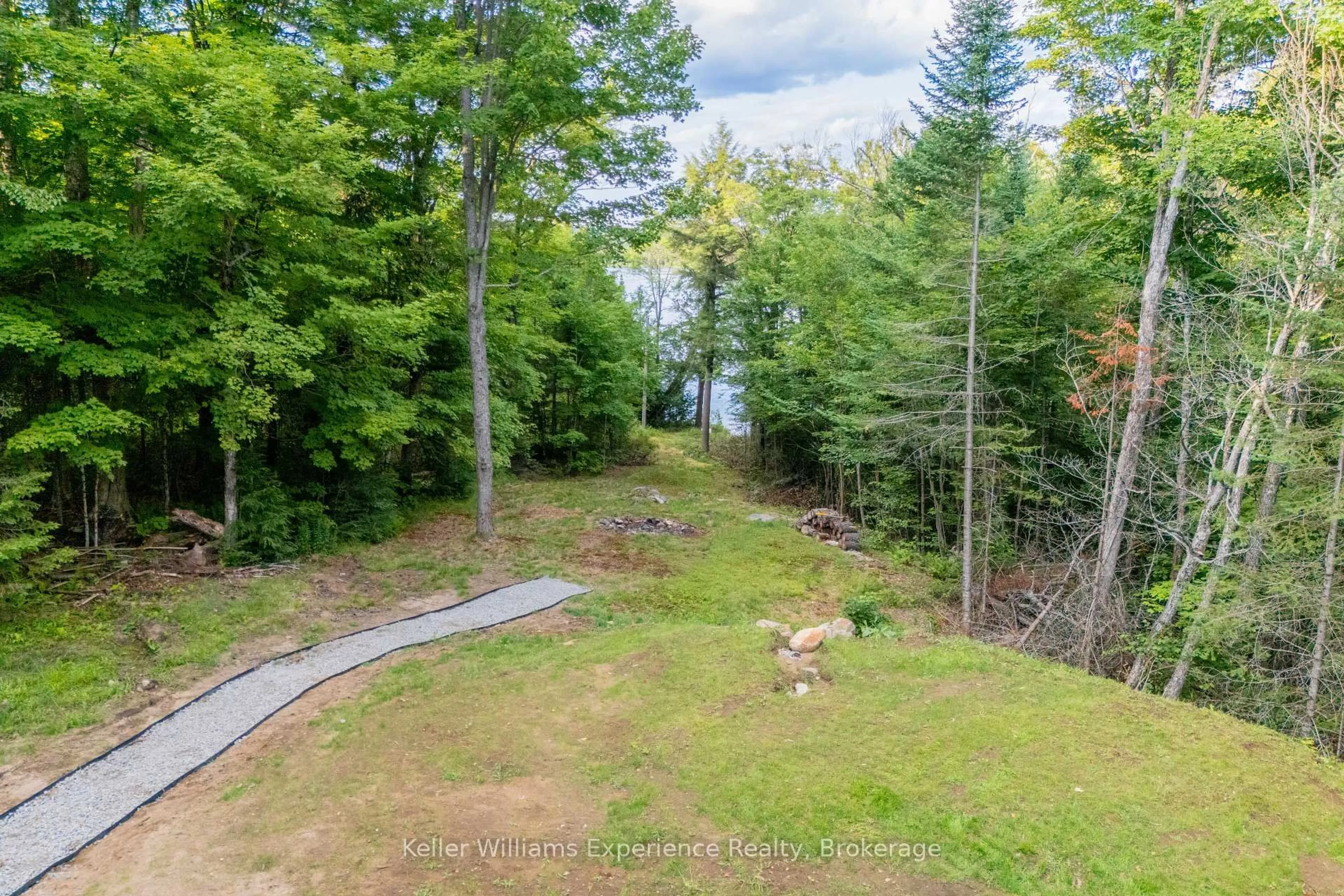 A pic from outside/outdoor area/front of a property/back of a property/a pic from drone, forest/trees view for 1382 Echo Ridge Rd, Kearney Ontario P0A 1M0