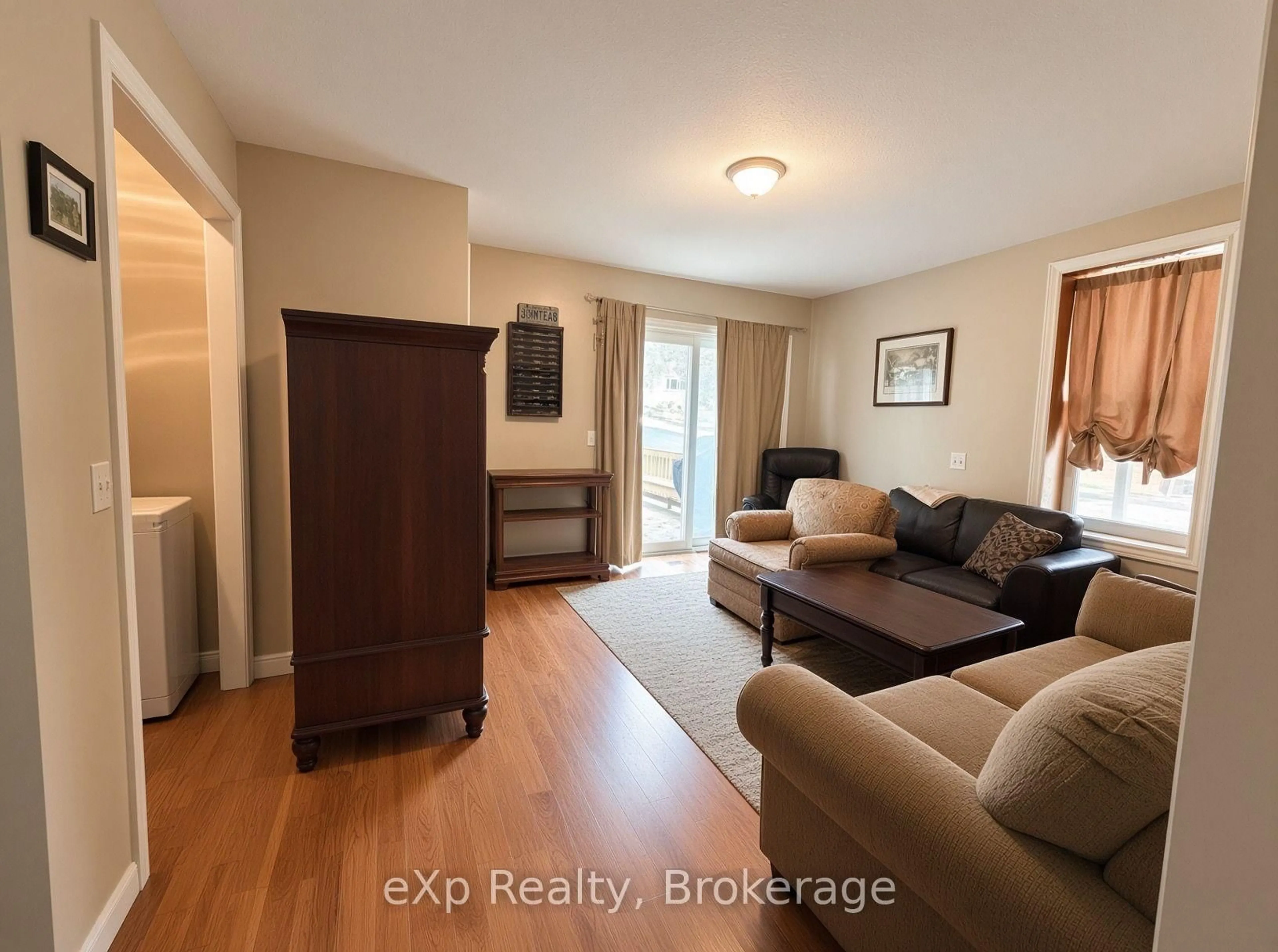 Living room with furniture, wood/laminate floor for 118 Elora St, South Bruce Ontario N0G 2J0