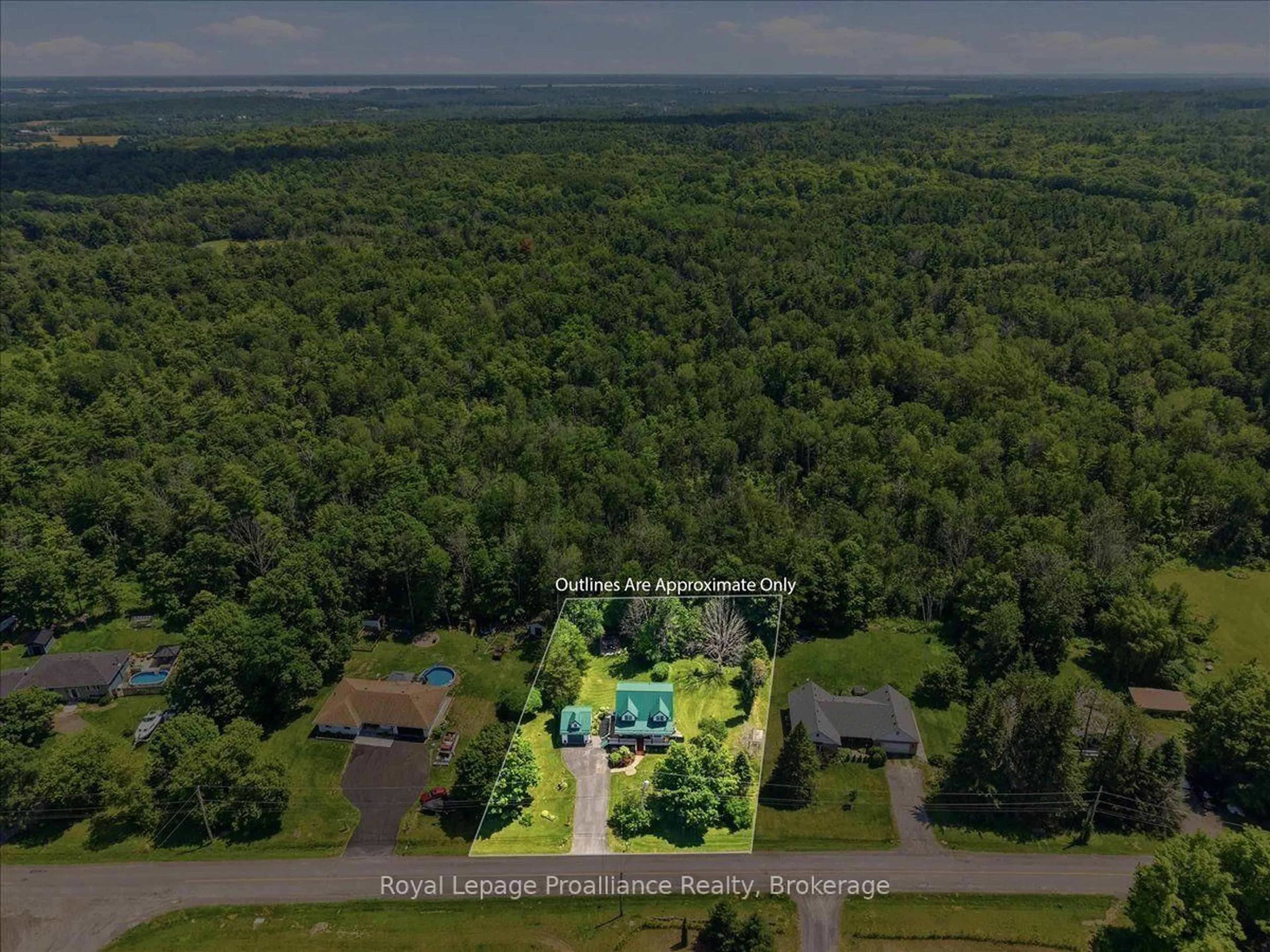 A pic from outside/outdoor area/front of a property/back of a property/a pic from drone, forest/trees view for 155 Downs Rd, Quinte West Ontario K8V 0A9