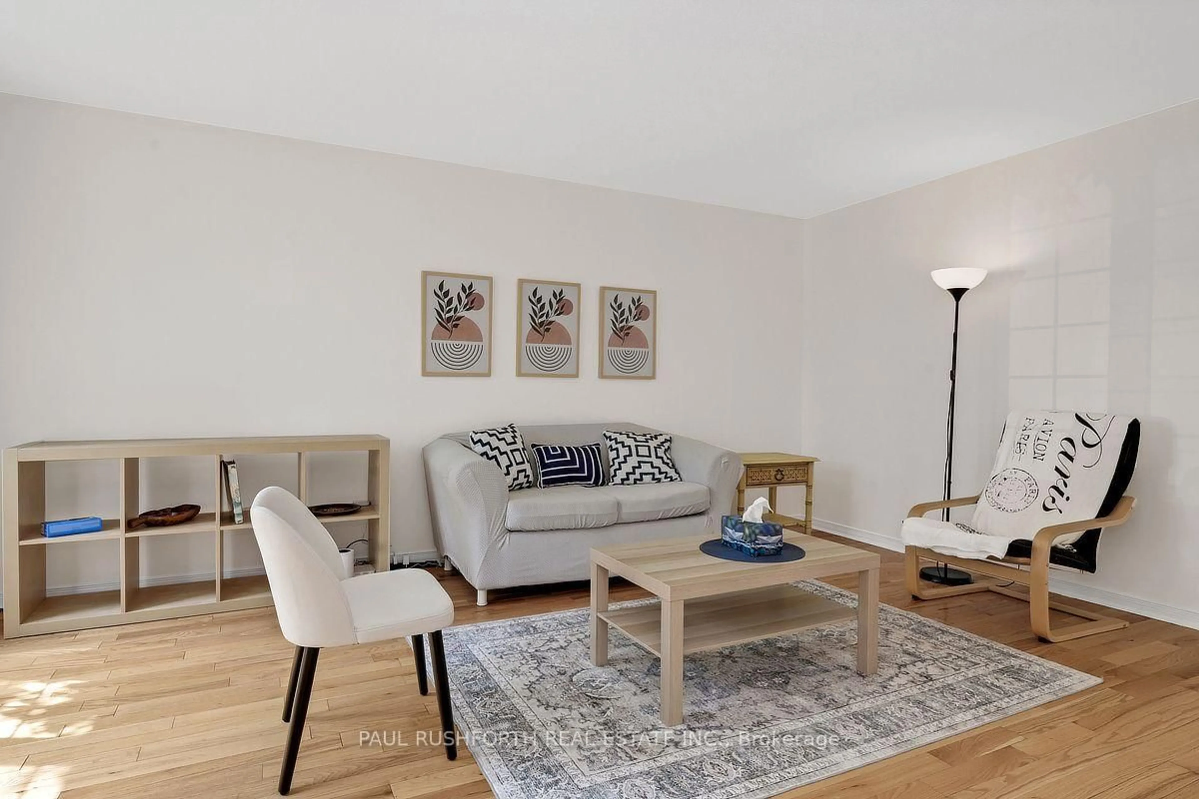 Living room with furniture, wood/laminate floor for 939 Greenbriar Ave, Ottawa Ontario K2C 0J8