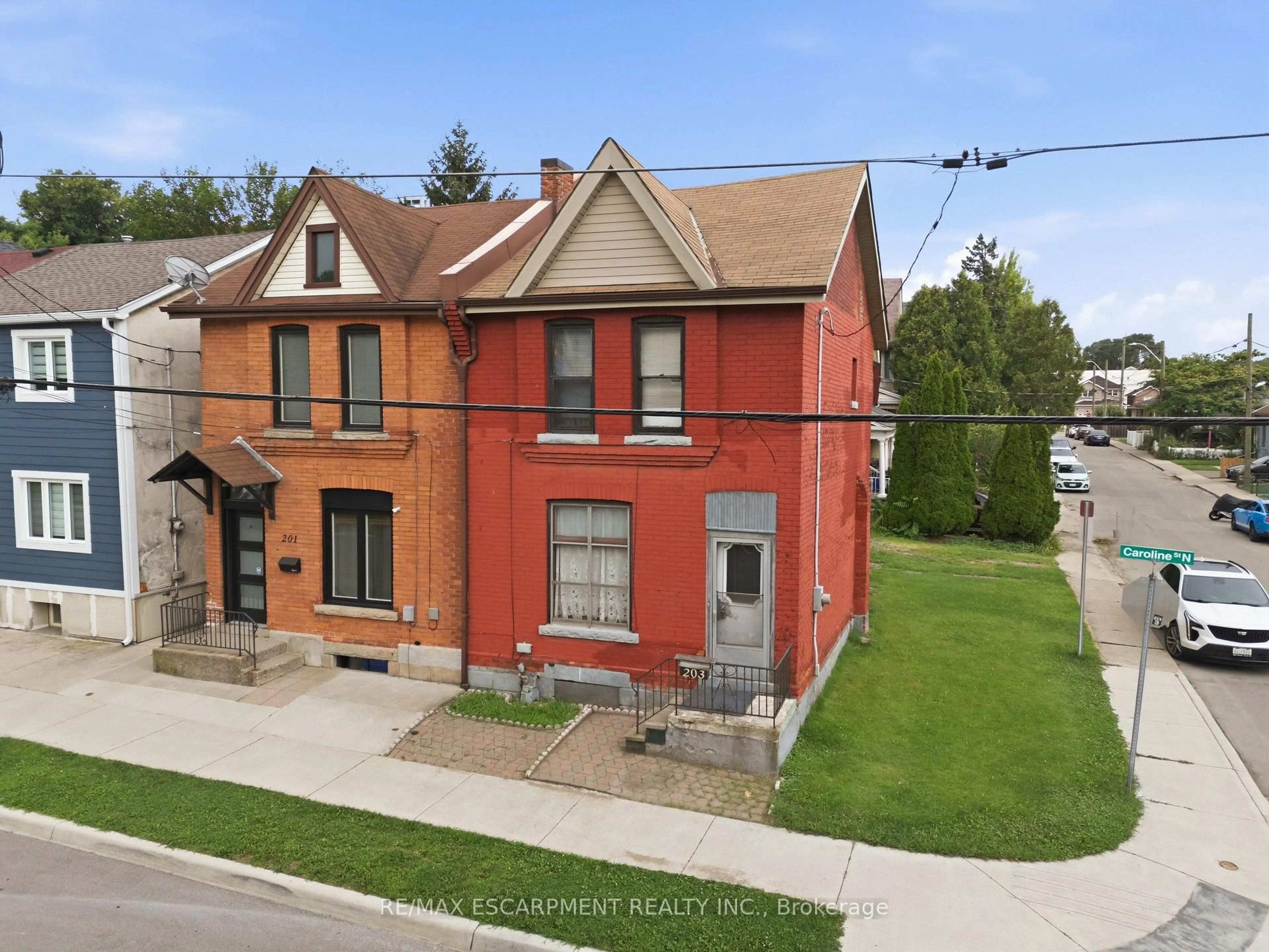 A pic from outside/outdoor area/front of a property/back of a property/a pic from drone, street for 203 Caroline St, Hamilton Ontario L8R 2S1