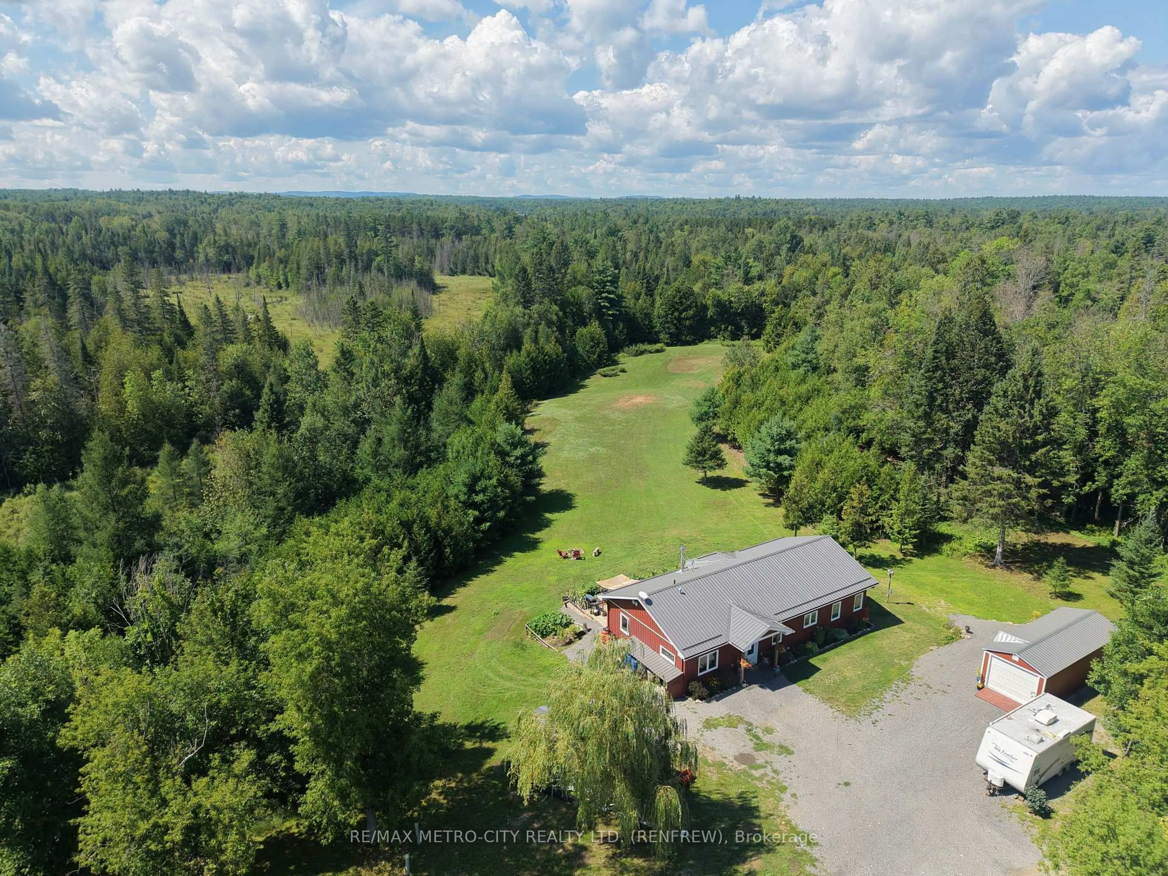 A pic from outside/outdoor area/front of a property/back of a property/a pic from drone, forest/trees view for 58 Dragonfly Rd, Renfrew Ontario K7V 3Z5