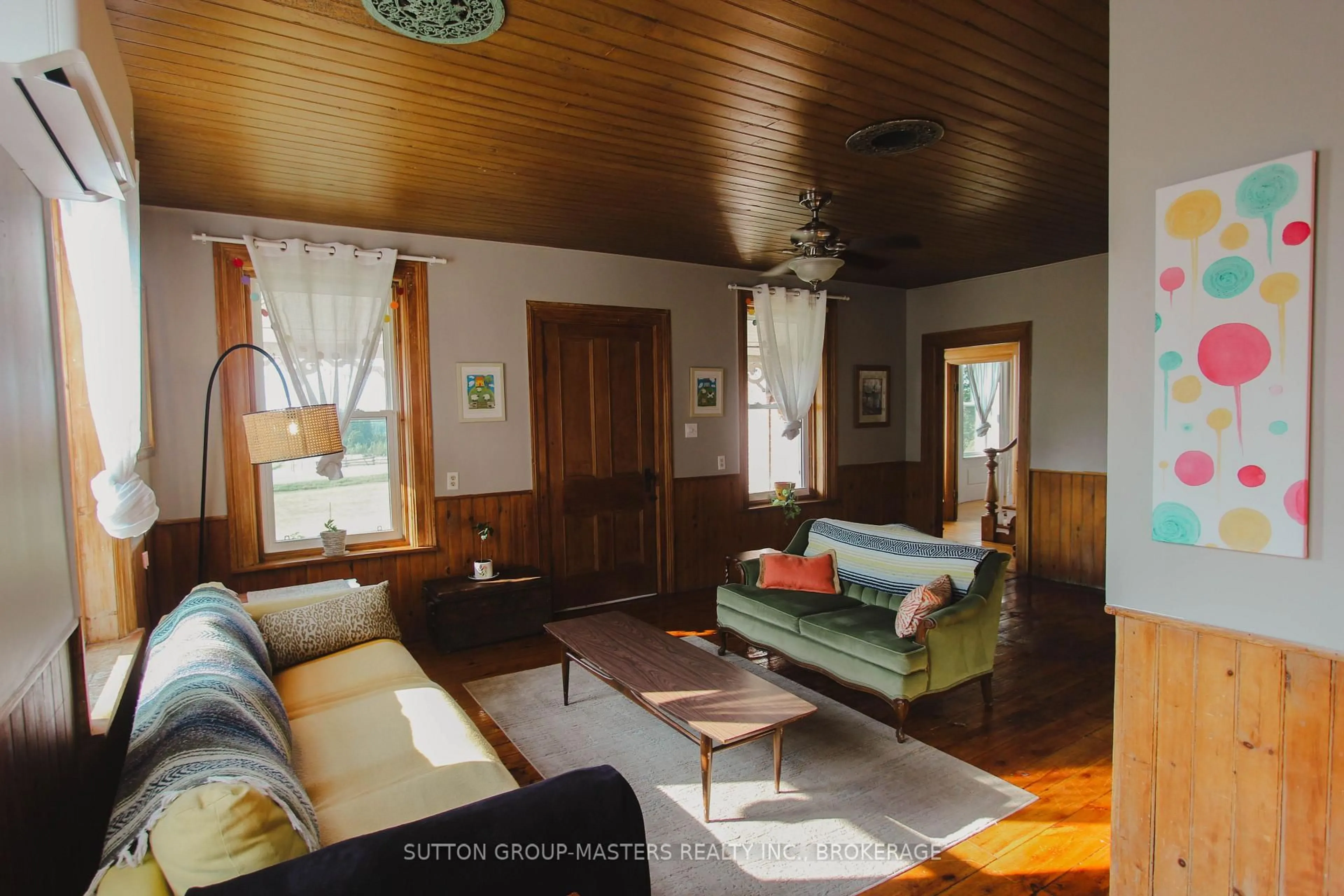 Living room with furniture, wood/laminate floor for 3858 County Rd 1 Rd, Yarker Ontario K0K 3N0