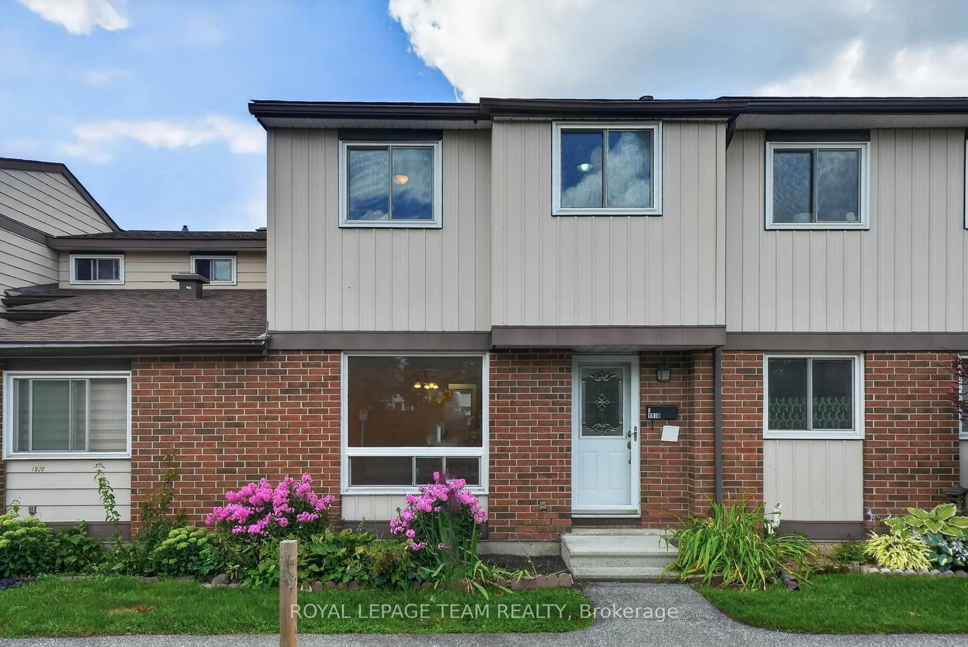 Home with brick exterior material, street for 1918 Belmore Lane #13, Ottawa Ontario K1B 4Z8